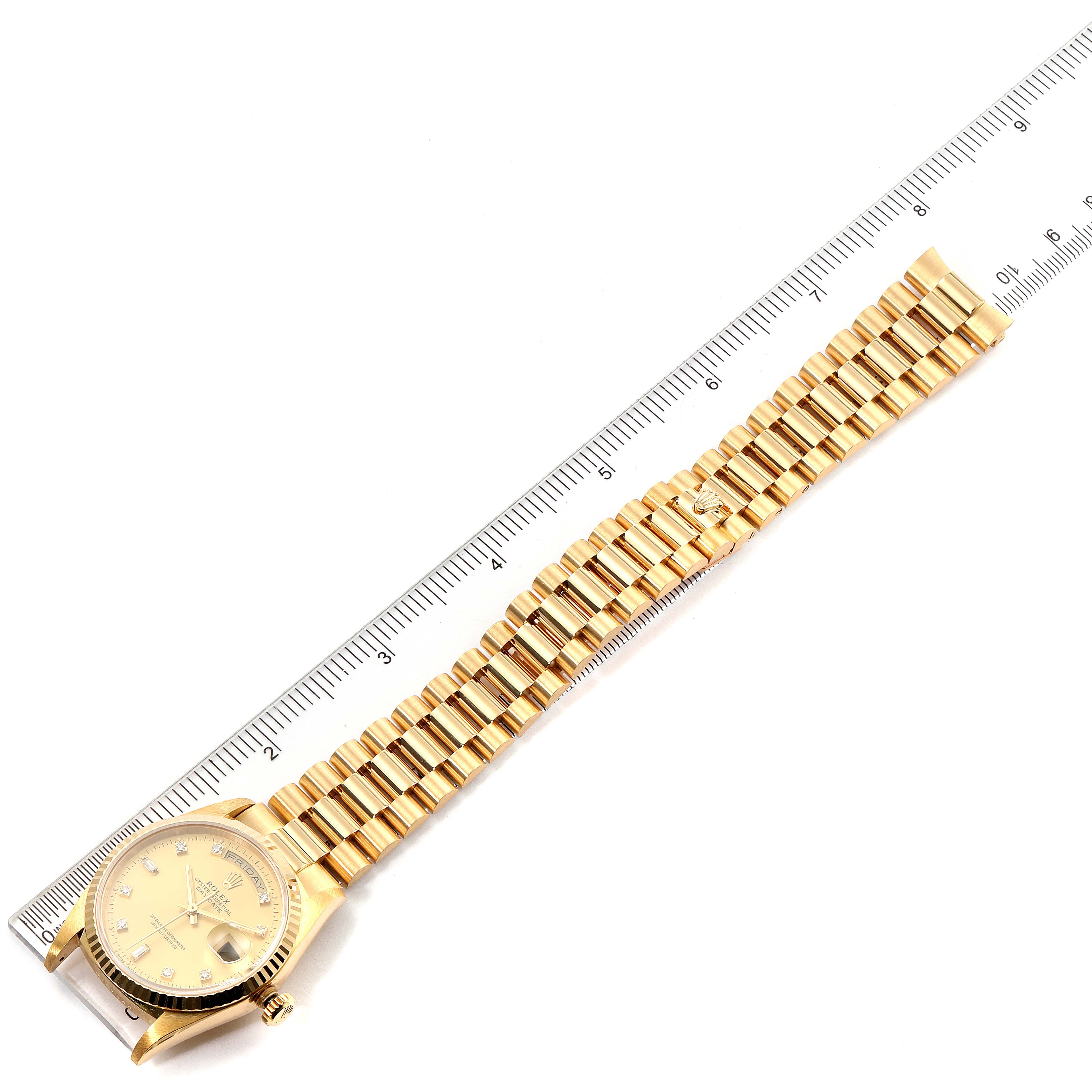 The image shows a Rolex President 18238 Men's Yellow Gold Champagne Dial 18238 Men's Yellow Gold Champagne Dial model watch laid flat with its dial and bracelet visible, next to a ruler for scale.