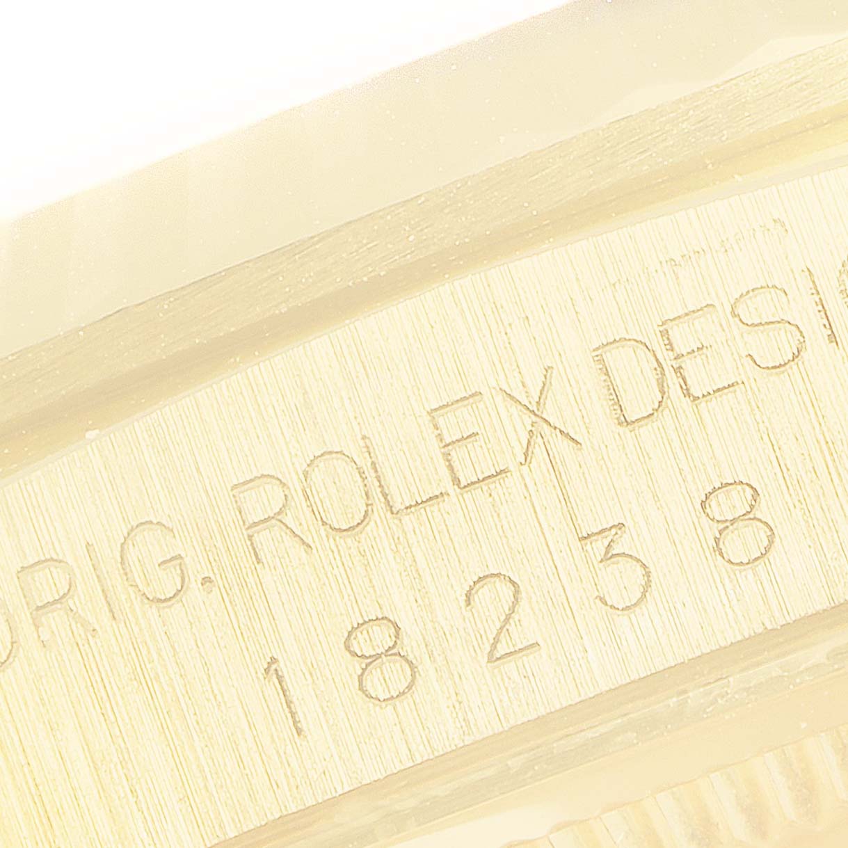 The image shows a close-up of the engraved inner bezel (rehaut) with the model number of a Rolex President 18238 Men's Yellow Gold Champagne Dial 18238 Men's Yellow Gold Champagne Dial watch.