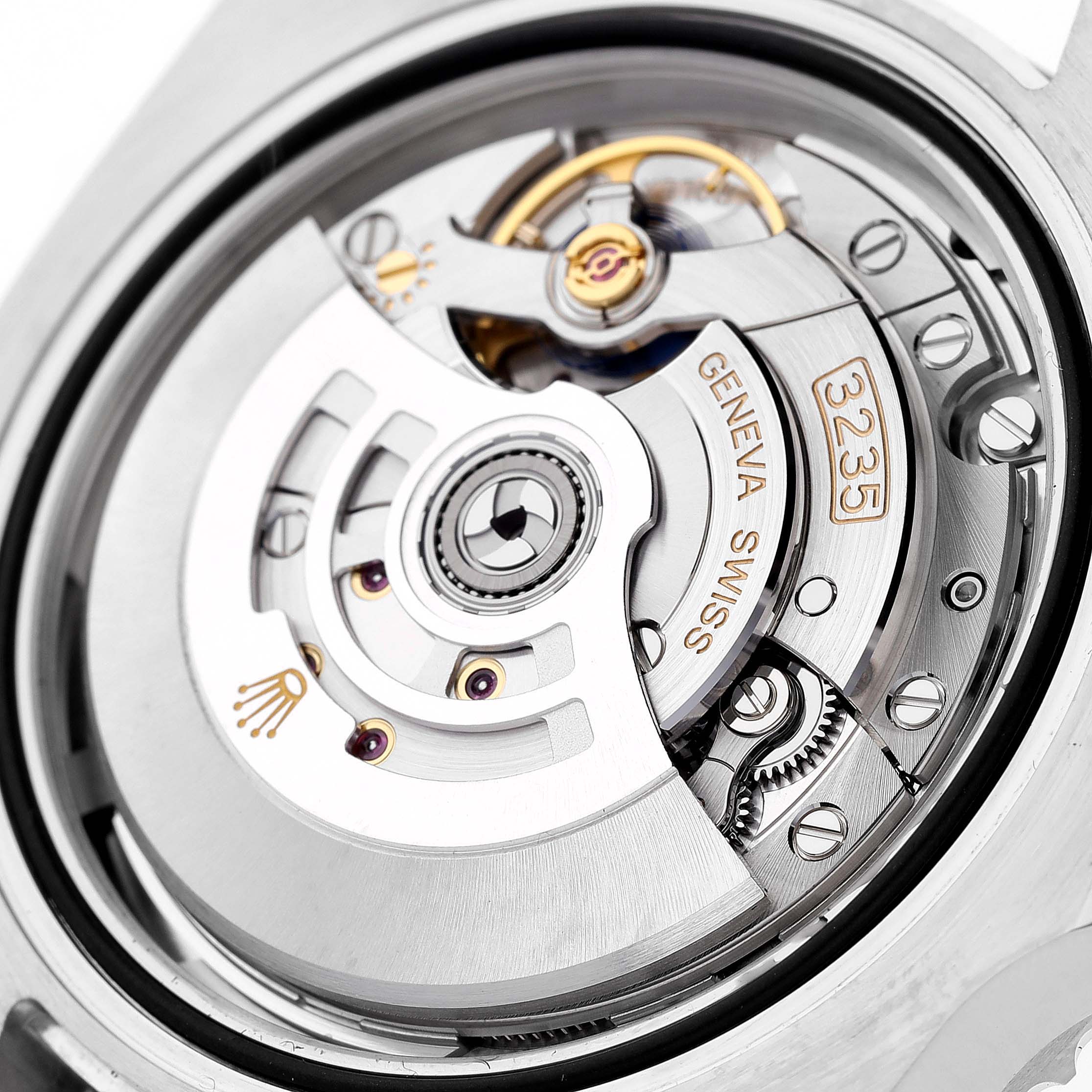 Close-up of the movement mechanism of a Rolex Submariner 126610 Men's Stainless Steel Black Dial 126610 Men's Stainless Steel Black Dial watch, showcasing intricate components and engravings.