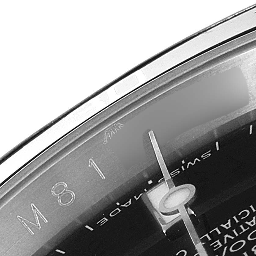 The image shows a close-up of the dial and bezel of the Rolex Submariner 16610 Men
s Stainless Steel Black Dial 16610 Men
s Stainless Steel Black Dial watch, highlighting the "SWISS MADE" text and part of the hour markers.
