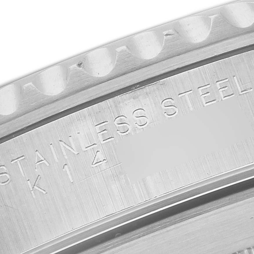 The image shows a close-up of the Rolex Submariner 14060 Men
s Stainless Steel Black Dial 14060 Men
s Stainless Steel Black Dial
s case side with "STAINLESS STEEL" engraving.