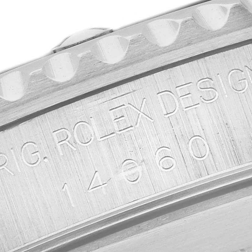 The image shows the side engraving on the rim of a Rolex Submariner 14060 Men
s Stainless Steel Black Dial 14060 Men
s Stainless Steel Black Dial watch case, highlighting its model number.