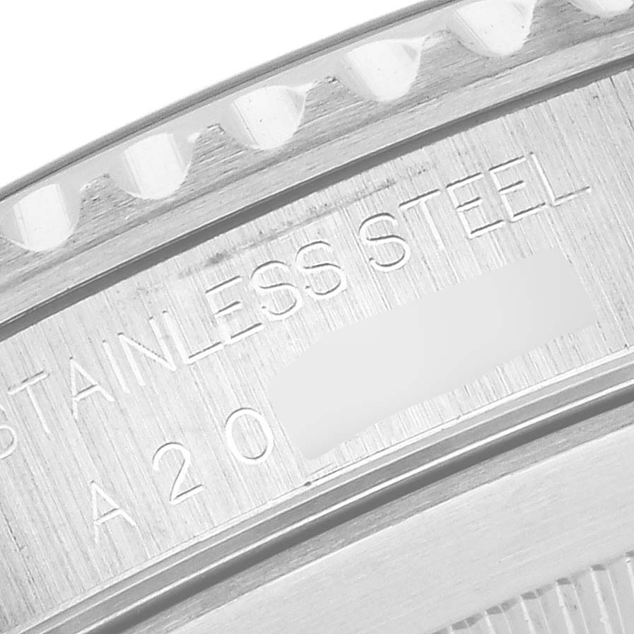 The image shows a close-up of the Rolex Submariner 14060 Men
s Stainless Steel Black Dial 14060 Men
s Stainless Steel Black Dial
s engraved case back, focusing on the stainless steel marking.