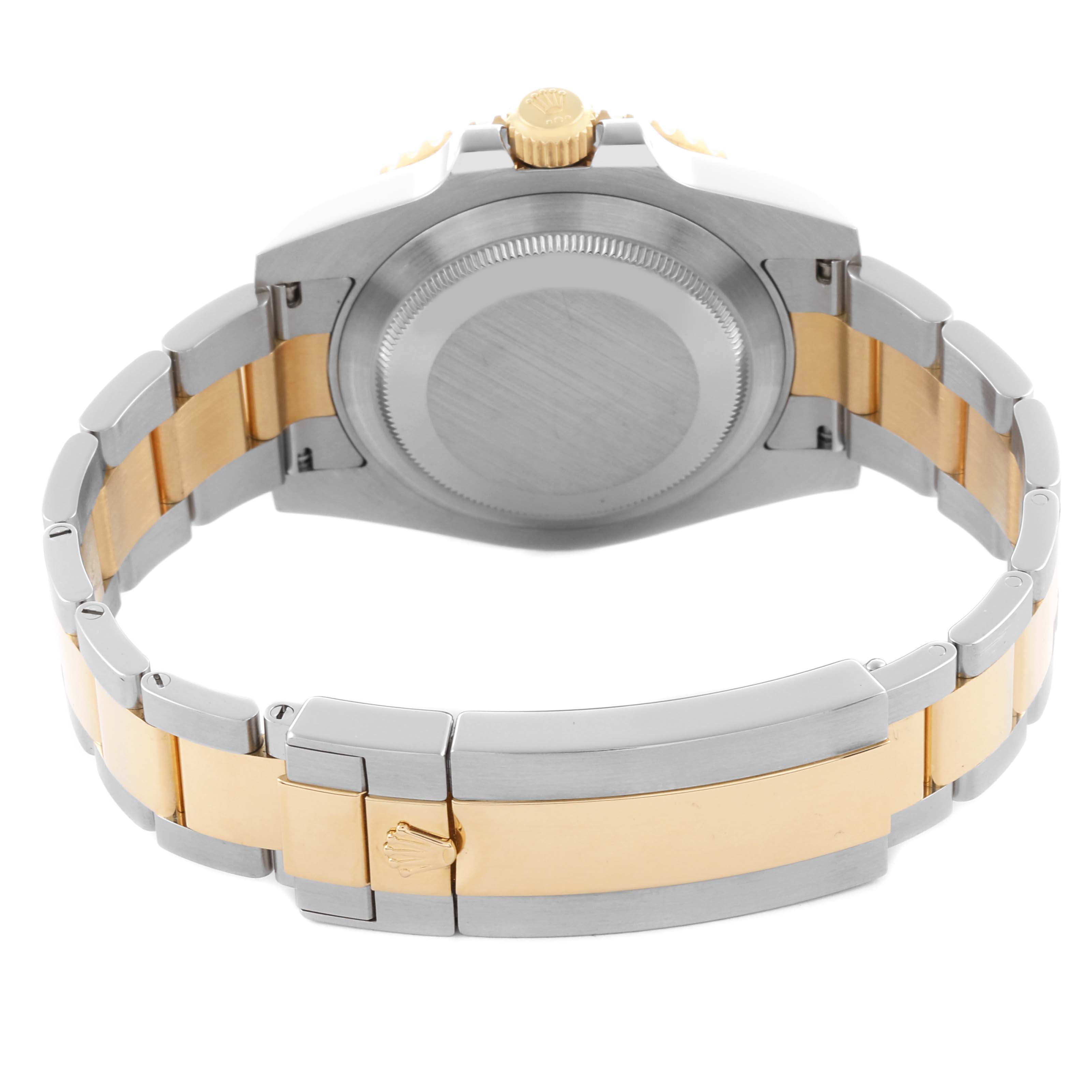 The image shows the backside of a Rolex Submariner 116613LB Men's Steel and Gold (two tone) Blue Dial 116613LB Men's Steel and Gold (two tone) Blue Dial, highlighting the case back, crown, and two-tone bracelet.