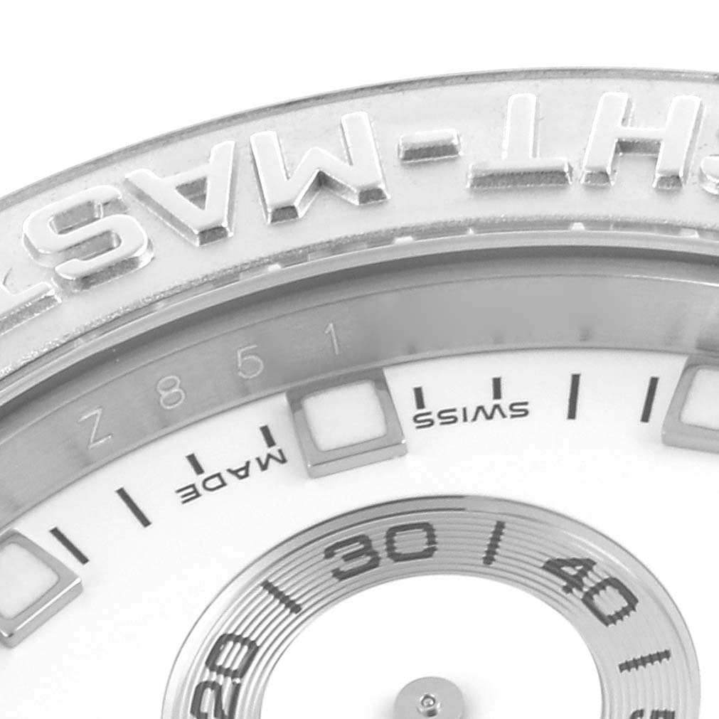 The image shows a close-up of the Rolex Yacht-Master 116689 Men
s White Gold White Dial 116689 Men
s White Gold White Dial
s bezel and part of the dial from a slightly tilted angle.