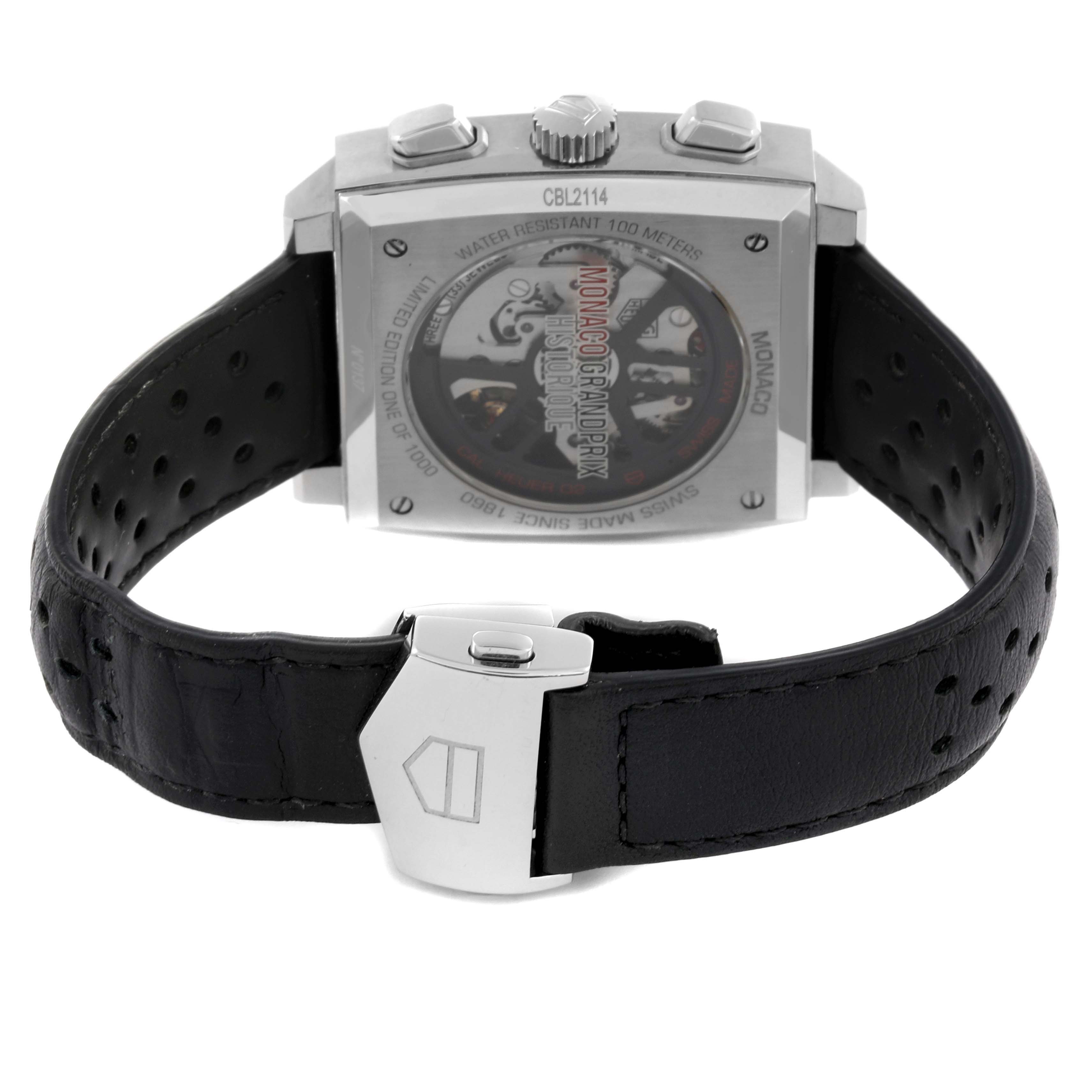 The Tag Heuer Monaco CBL2114 Men's Stainless Steel Red Dial CBL2114 Men's Stainless Steel Red Dial watch is shown from the back, highlighting the caseback and part of the leather band.