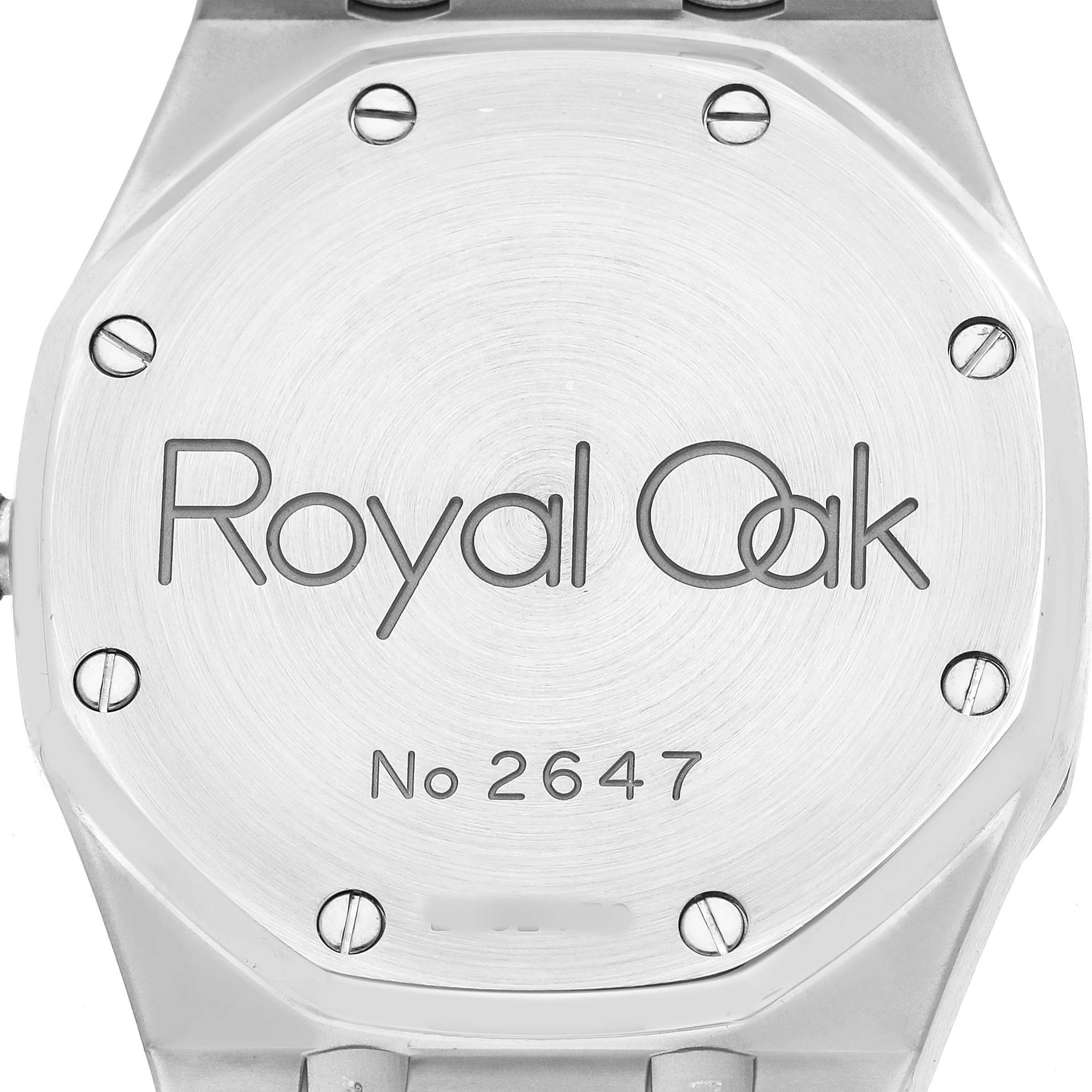 The image shows the back of a Royal Oak watch by Audemars Piguet, highlighting the engravings and screws.