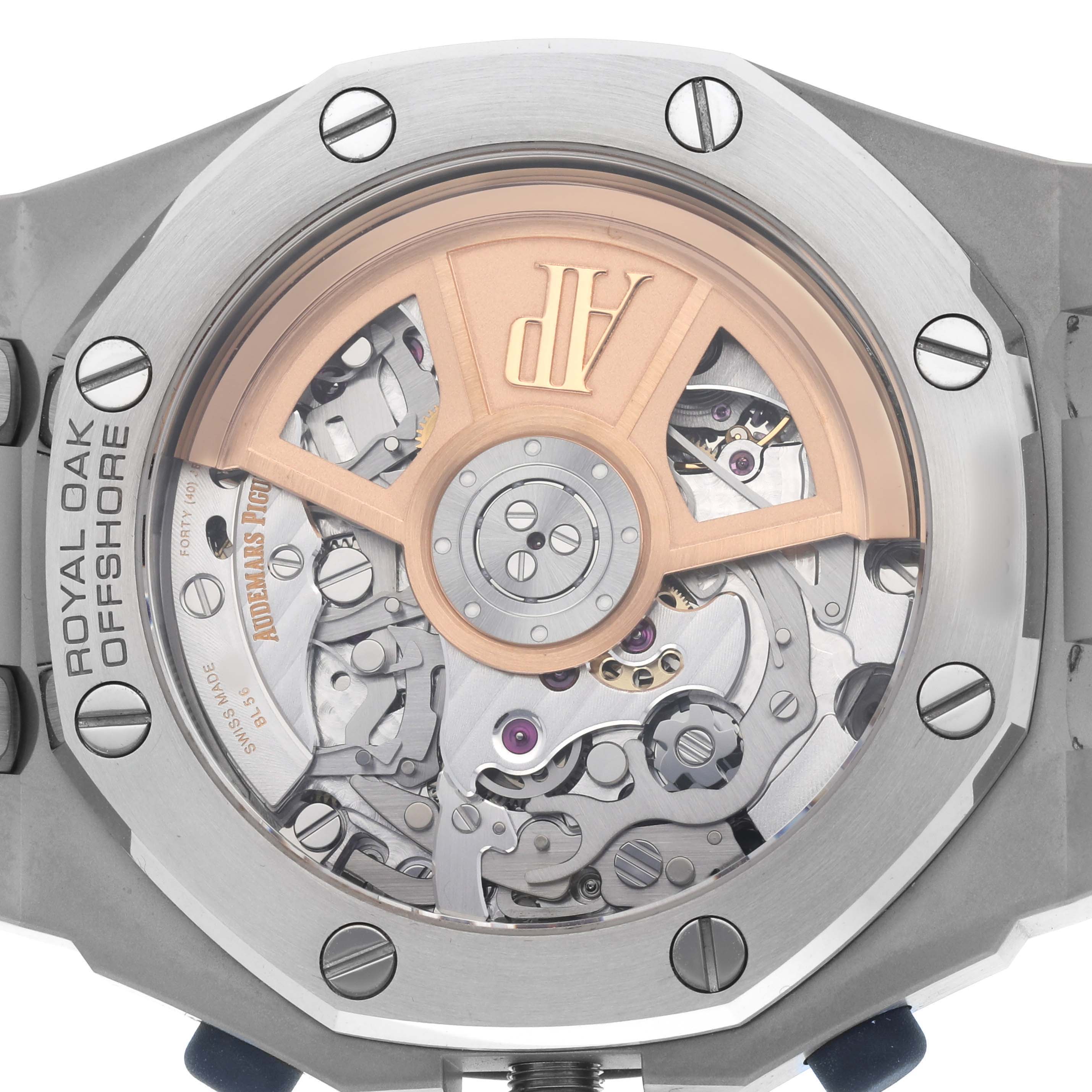 The image displays the back view of an Audemars Piguet Royal Oak Offshore 26238ST Men's Stainless Steel Blue Dial, showing its intricate movement and rotor.