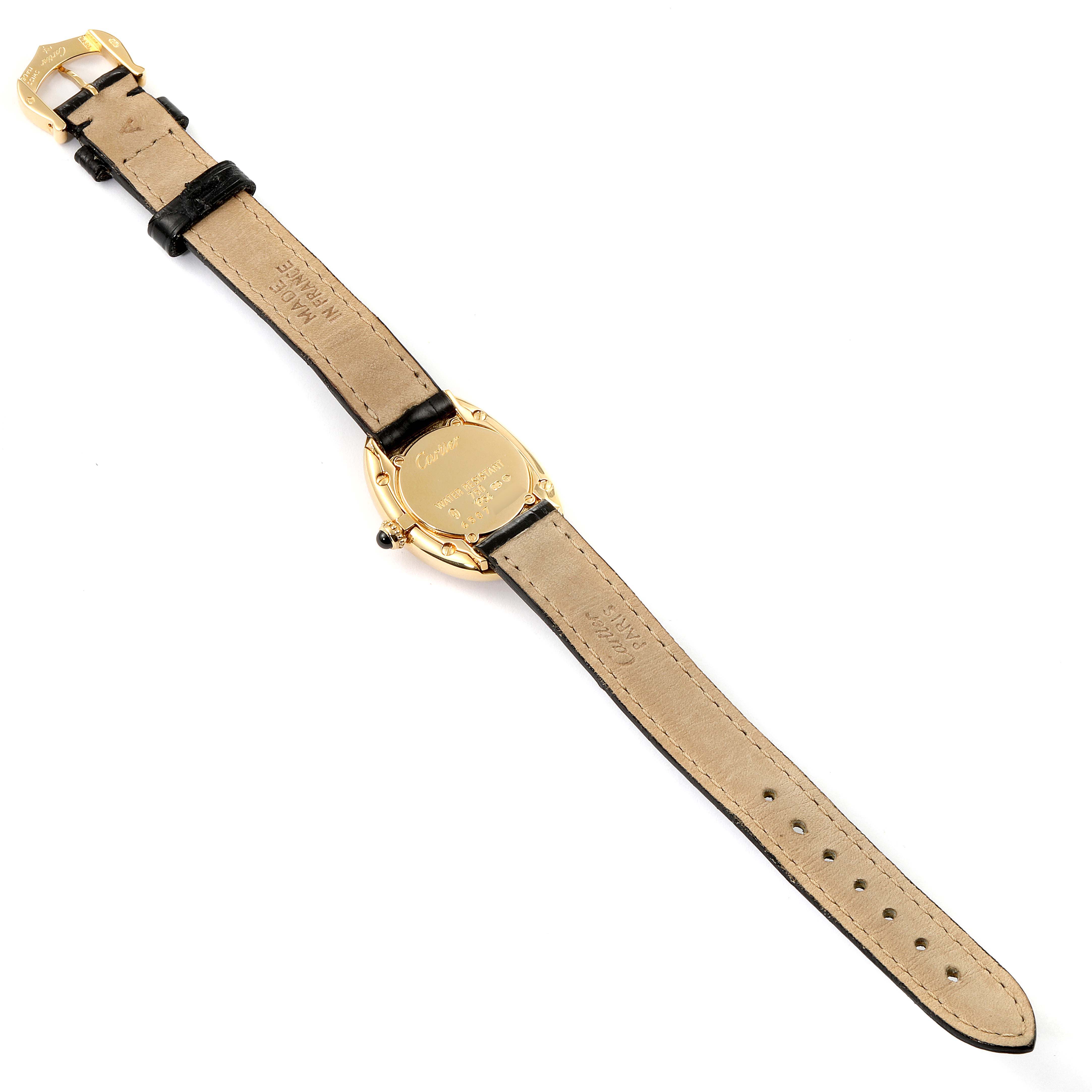 The image shows the backside and strap of a Cartier Baignoire 1954 Women's Yellow Gold Silver Dial 1954 Women's Yellow Gold Silver Dial watch, highlighting the case back, buckle, and strap details.