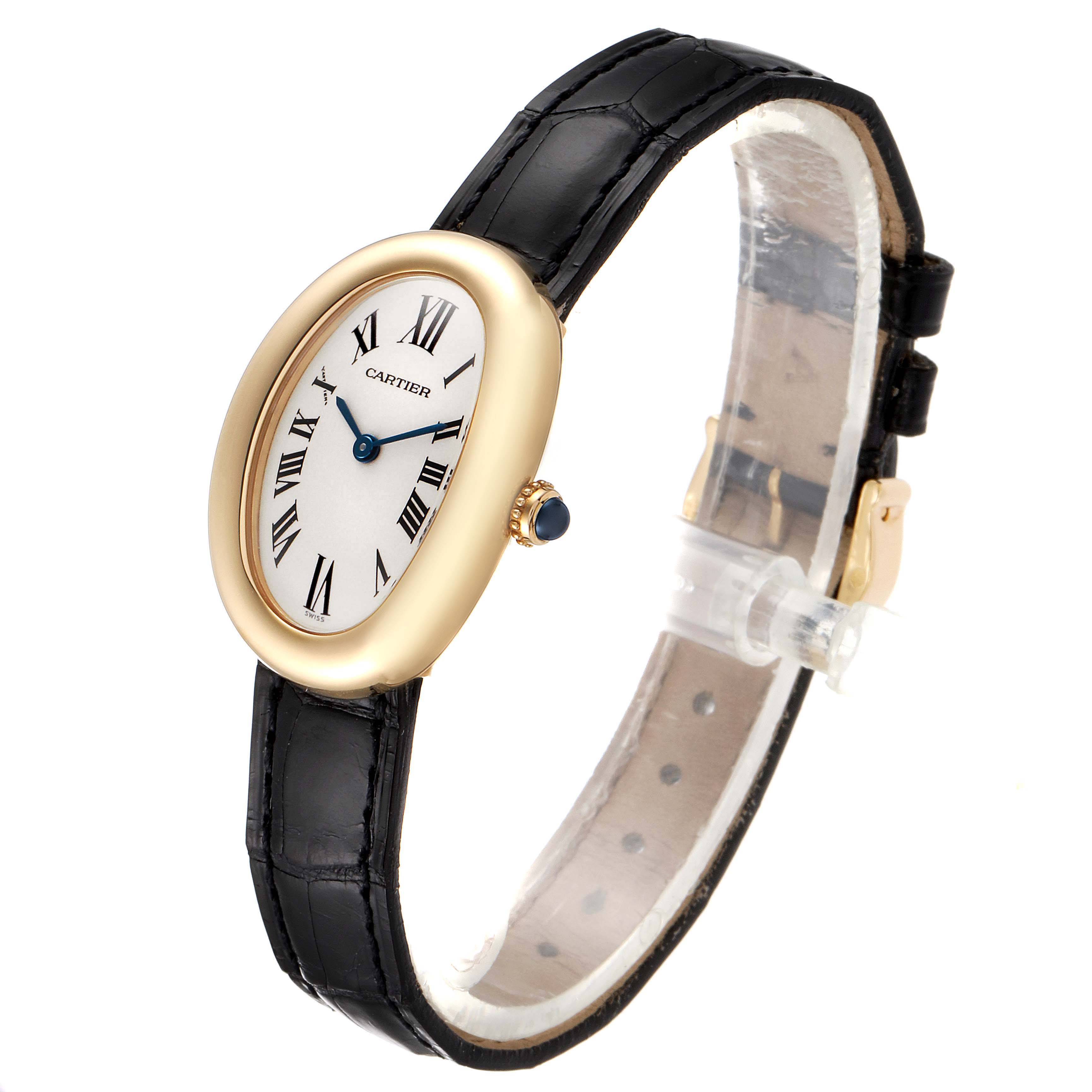 The Cartieg Baignoire watch is shown in a side angle, displaying the dial, case, crown, and black leather strap.