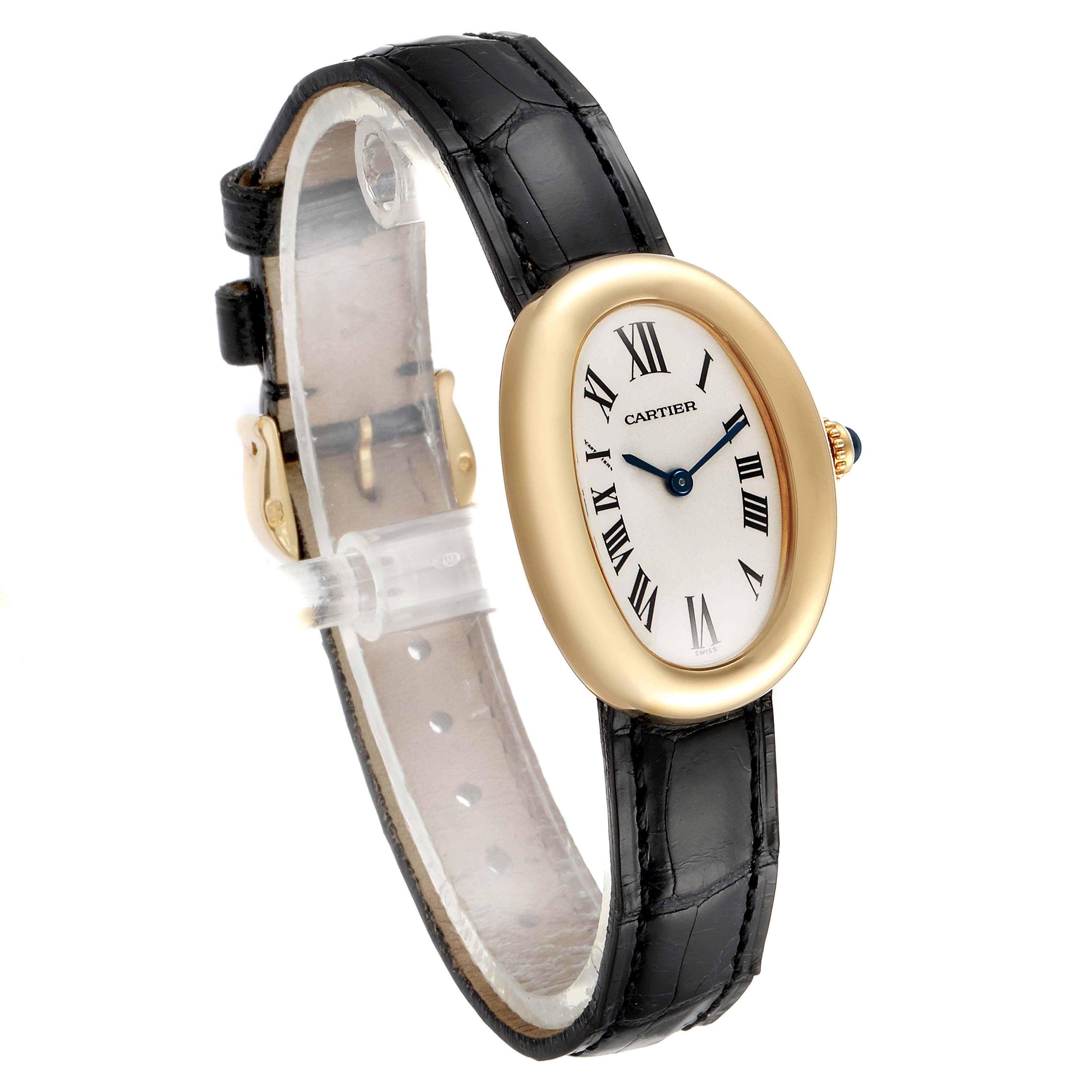 The image shows a side-angle view of a Cartier Baignoire 1954 Women's Yellow Gold Silver Dial 1954 Women's Yellow Gold Silver Dial model, highlighting its oval face, Roman numerals, and black leather strap.
