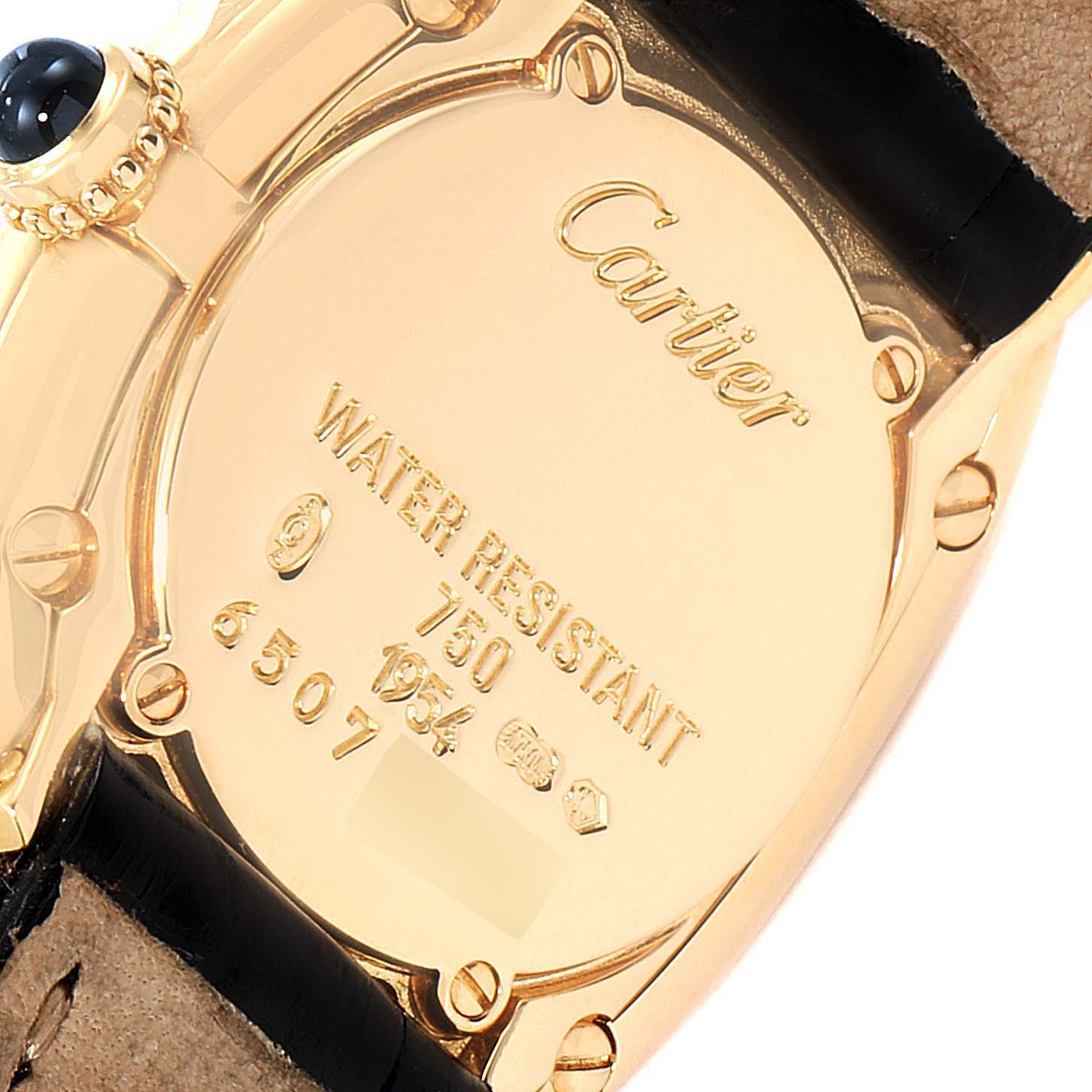 The image shows the back case of a Cartier Baignoire 1954 Women's Yellow Gold Silver Dial 1954 Women's Yellow Gold Silver Dial watch, focusing on the brand engraving and water resistance markings.