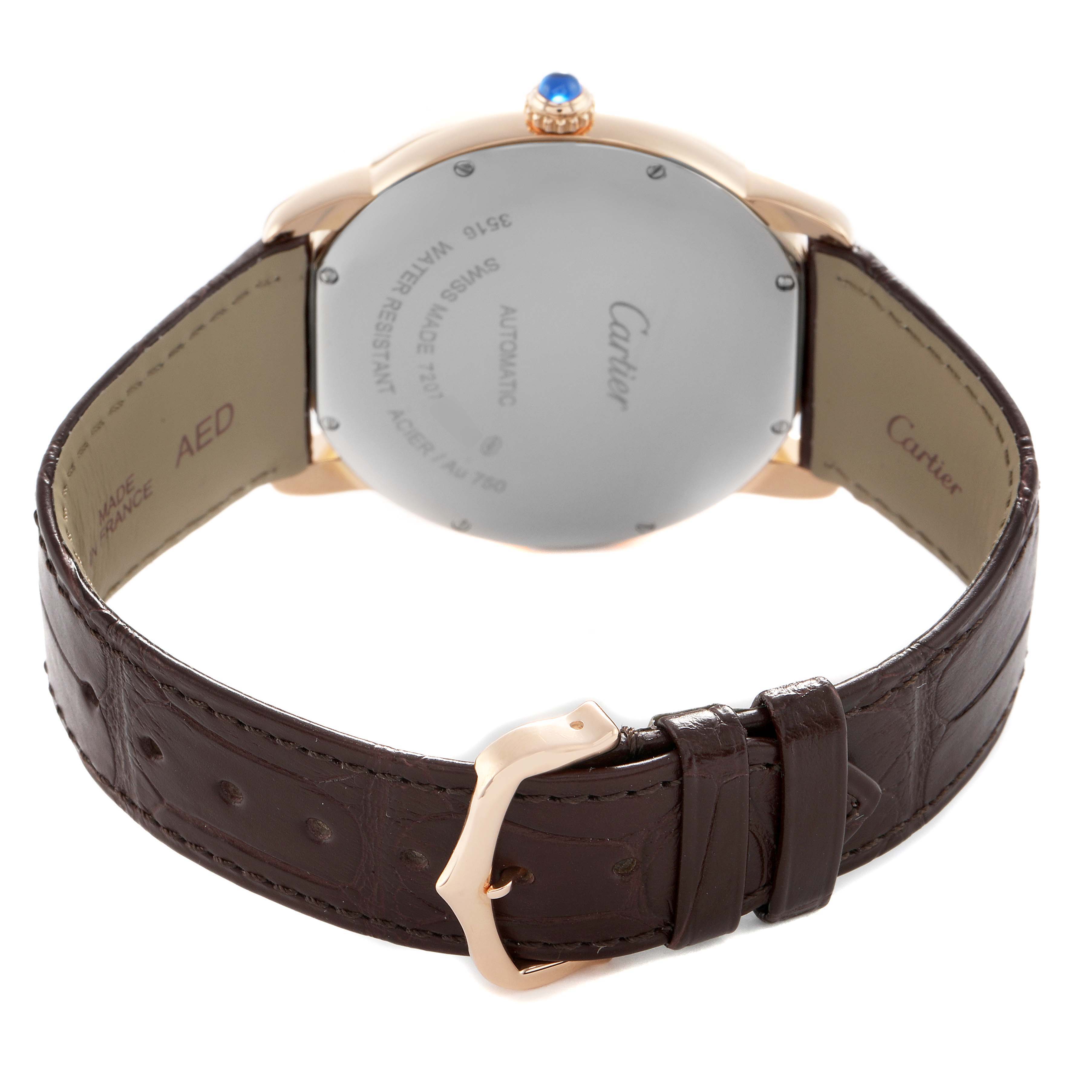 The Cartier Ronde W6701009 Men's Rose Gold Silver Dial watch is shown from the back, displaying its case, strap, buckle, and blue cabochon crown.