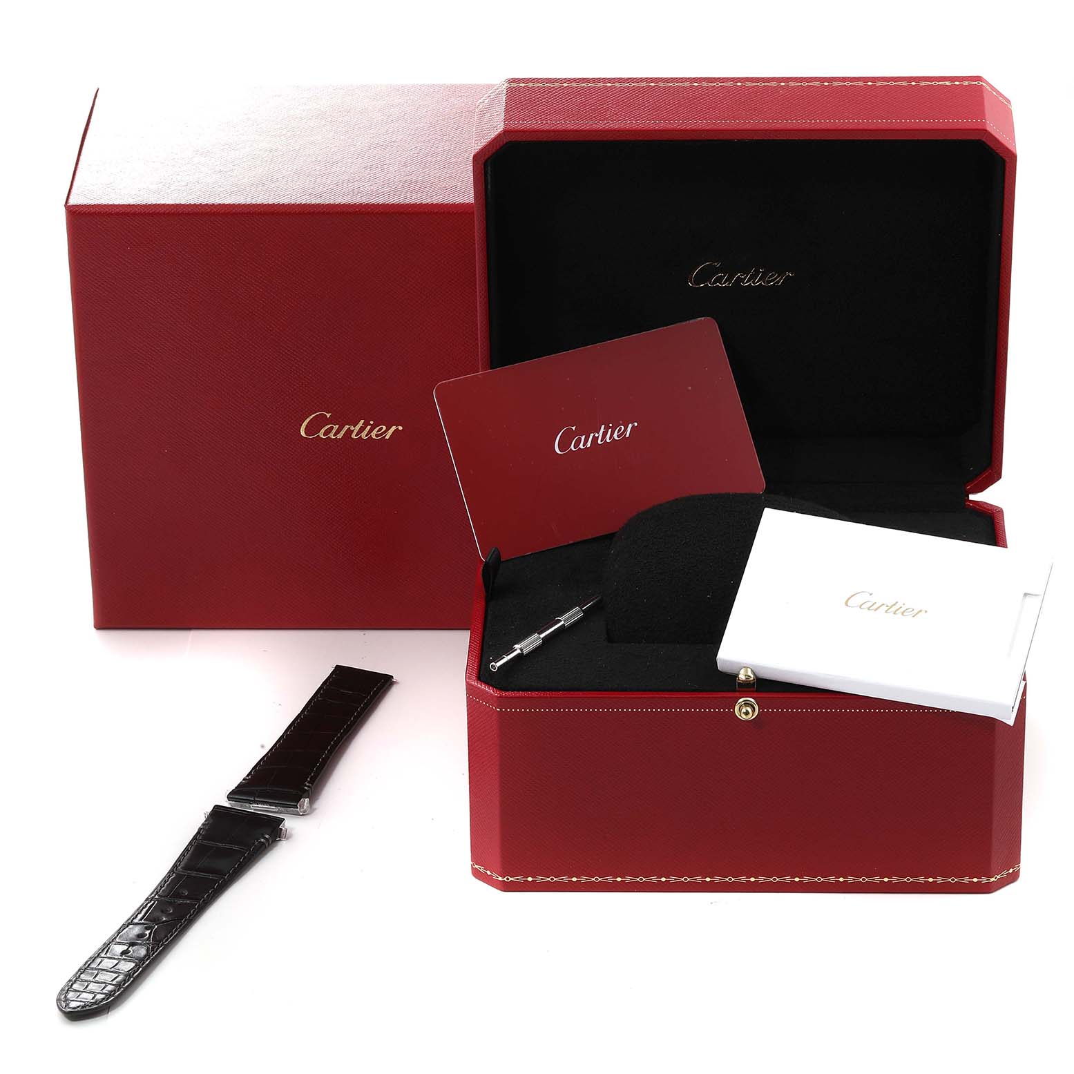 The image shows an open red Cartier box for the Santos model with a strap, tools, and pamphlets.
