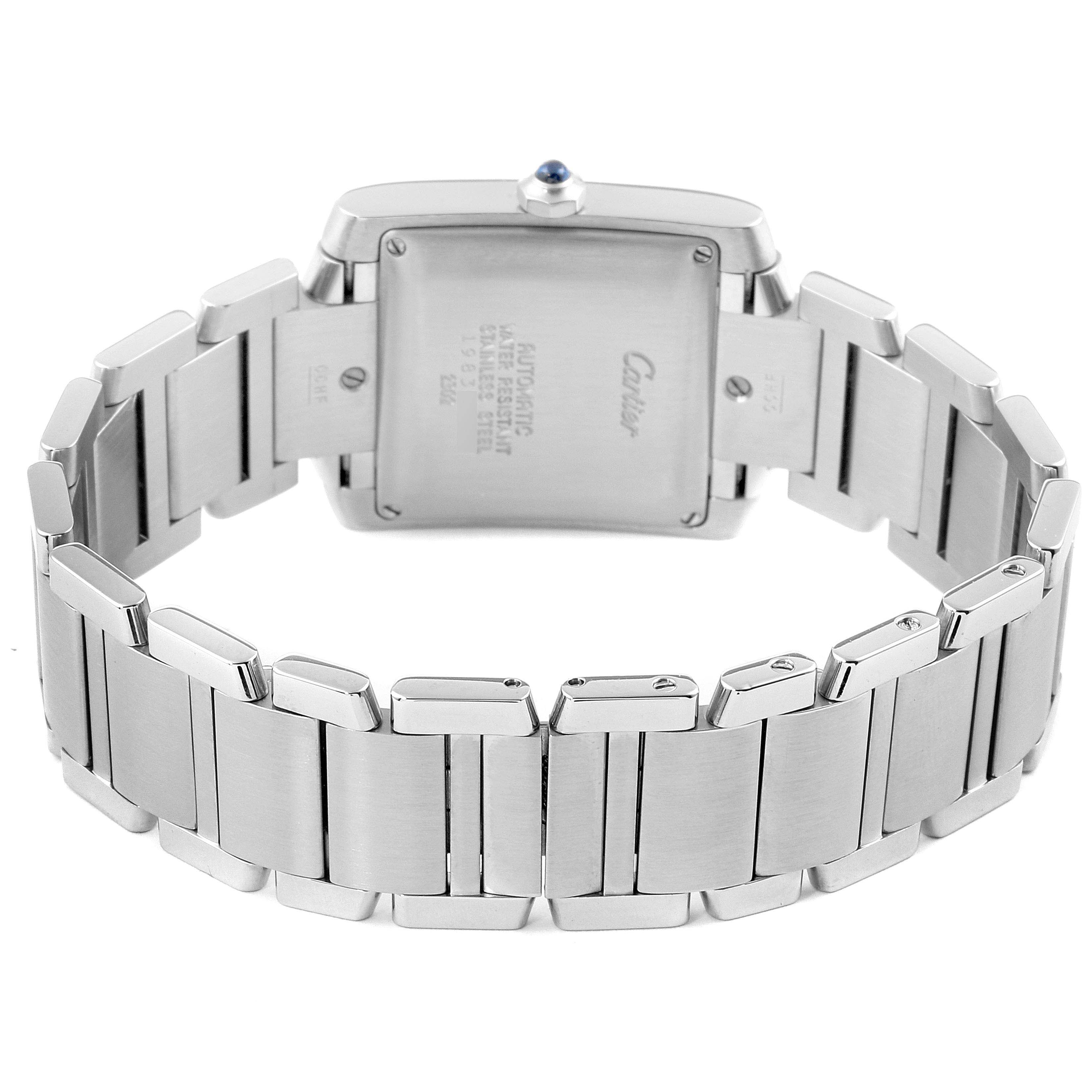 This image shows the back view of a Cartier Tank Française watch, focusing on the case back and metal bracelet.