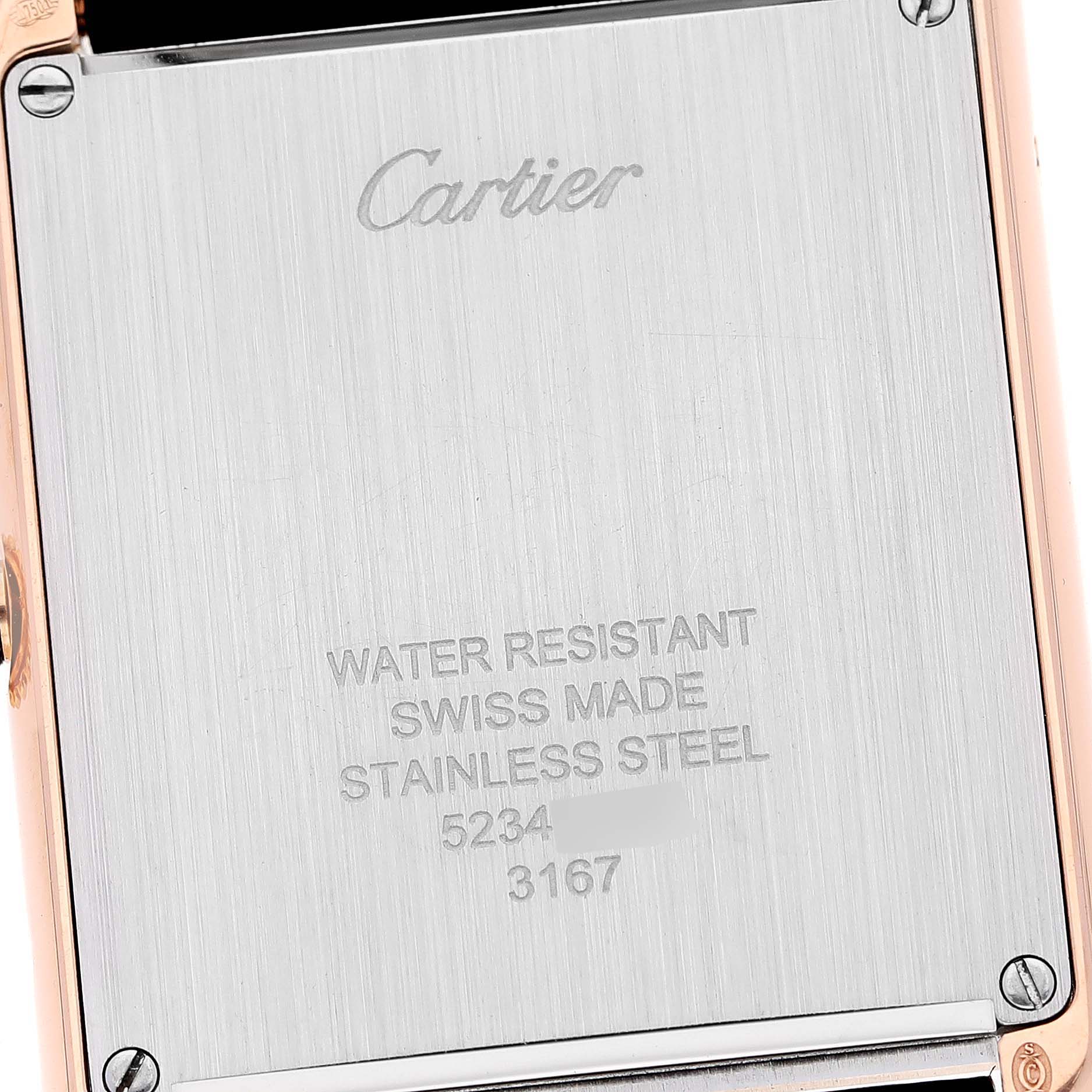 This image shows the back case of a Cartier Tank Solo W5200025 Men
s Steel and Gold (two tone) Silver Dial W5200025 Men
s Steel and Gold (two tone) Silver Dial watch with engraved details about water resistance and material.