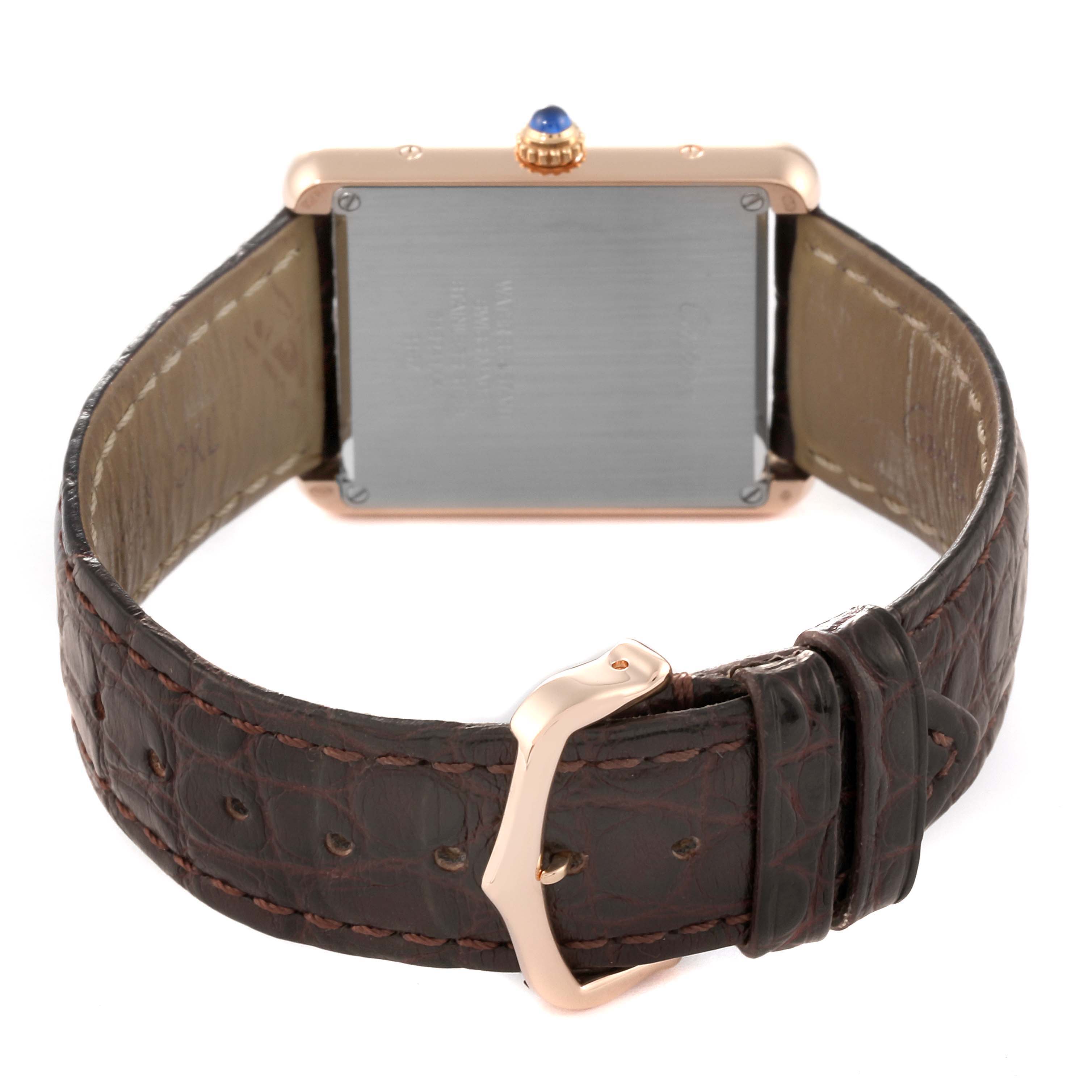 The image shows the back view of the Cartier Tank Solo W5200025 Men's Steel and Gold (two tone) Silver Dial W5200025 Men's Steel and Gold (two tone) Silver Dial watch, highlighting the case back, crown, and leather strap with a buckle.