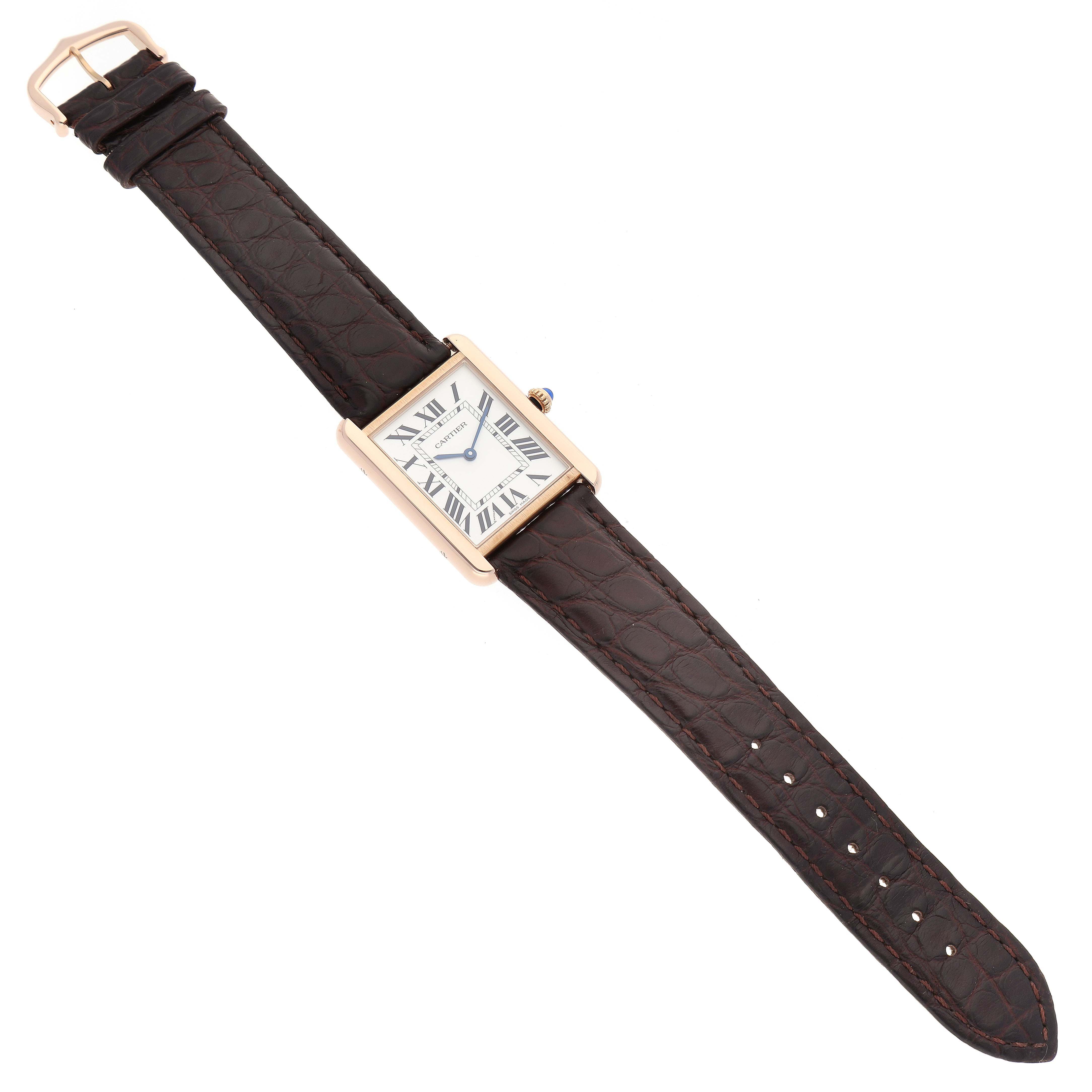 The image shows a top-down view of a Cartier Tank Solo W5200025 Men's Steel and Gold (two tone) Silver Dial W5200025 Men's Steel and Gold (two tone) Silver Dial watch with a rectangular face and a brown leather strap.