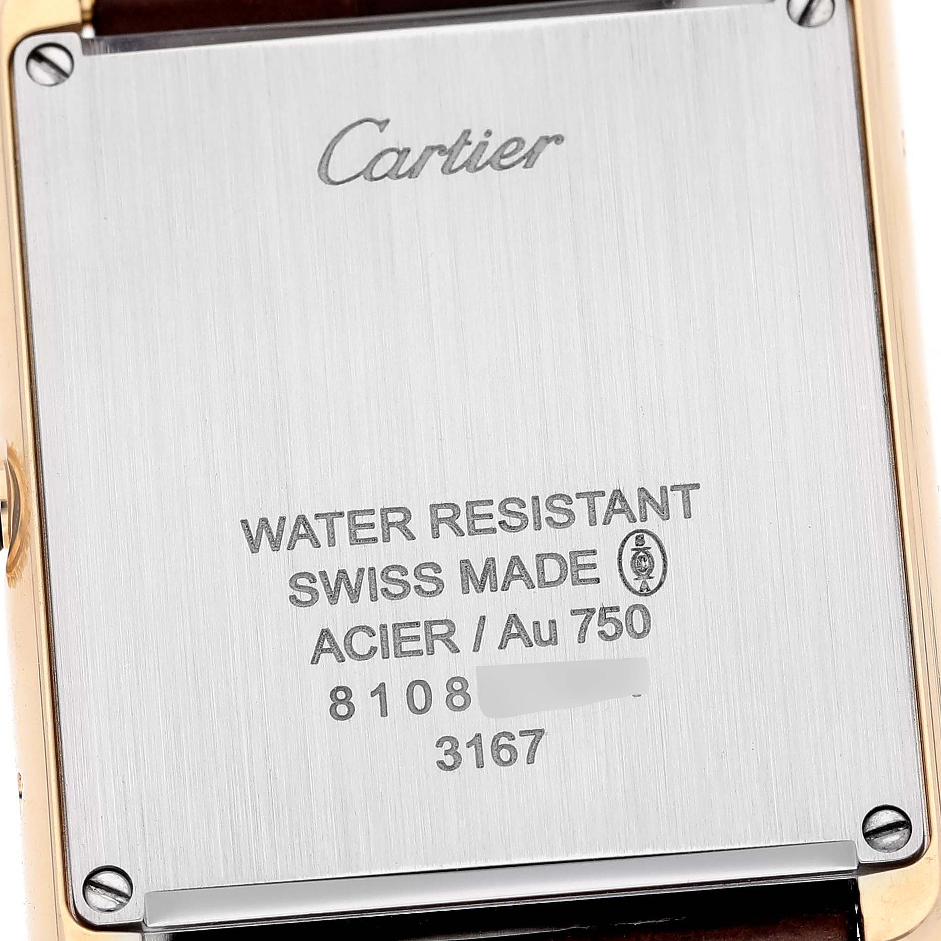 The image shows the back case of a Cartier Tank Solo W5200004 Men
s Steel and Gold (two tone) Silver Dial W5200004 Men
s Steel and Gold (two tone) Silver Dial watch, highlighting its inscriptions and material details.