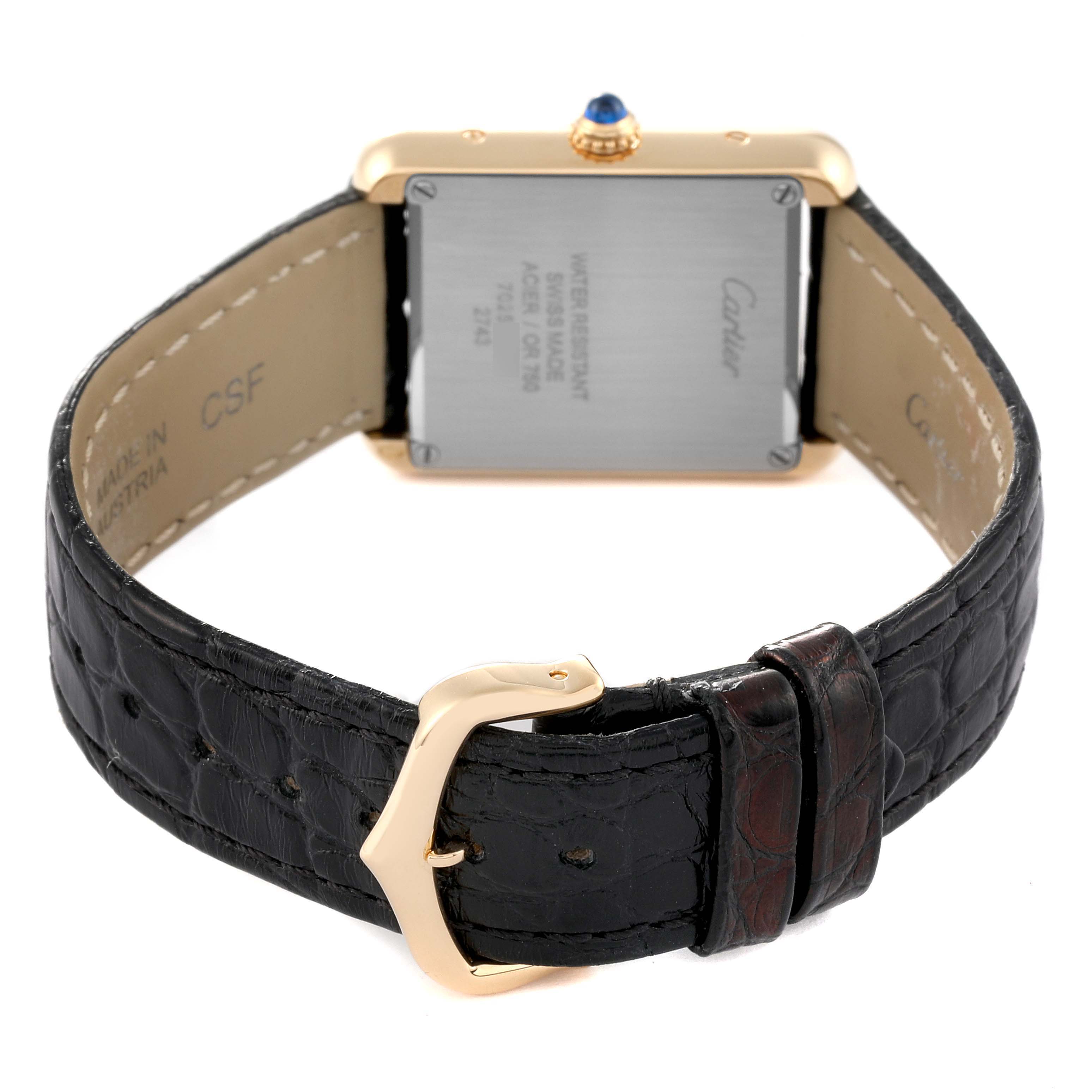 The image shows the back angle of the Cartier Tank Solo W1018755 Women's Yellow Gold Silver Dial W1018755 Women's Yellow Gold Silver Dial watch, focusing on the case back and black leather strap with a gold buckle.