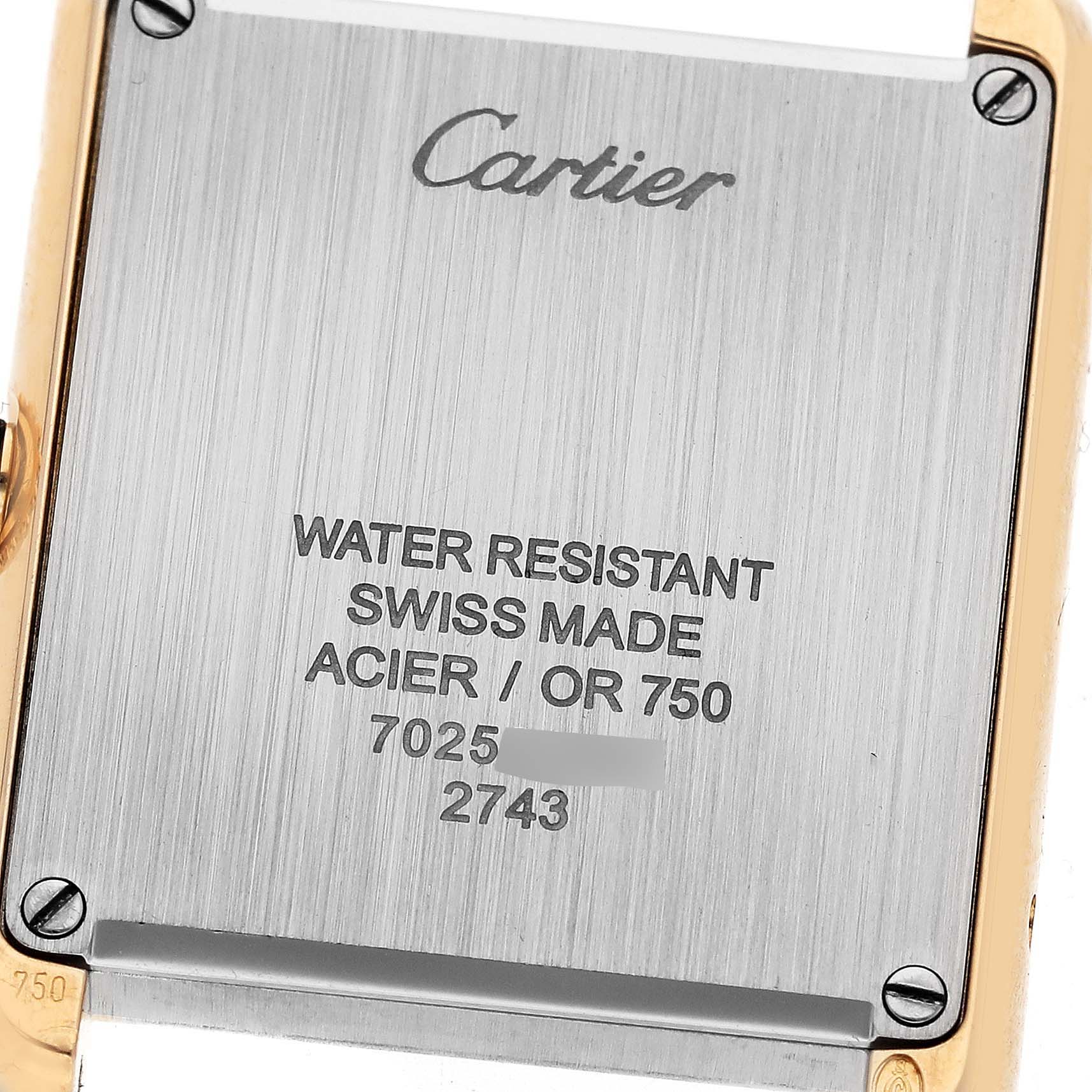 The image shows the backside of the Cartier Tank Solo W1018755 Women's Yellow Gold Silver Dial W1018755 Women's Yellow Gold Silver Dial watch, displaying model numbers and water resistance details.