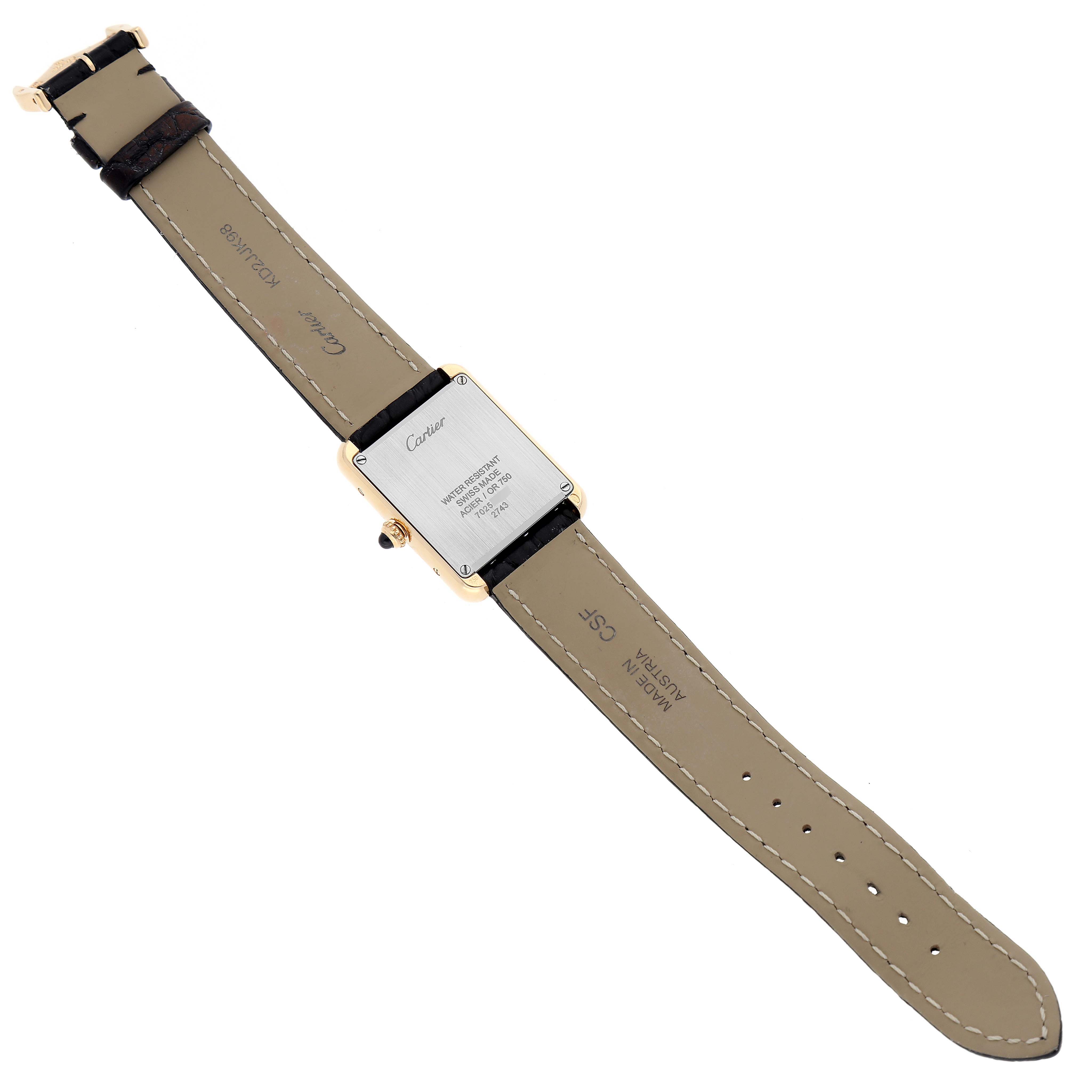 The image shows the back and strap of a Cartier Tank Solo W1018755 Women's Yellow Gold Silver Dial W1018755 Women's Yellow Gold Silver Dial watch lying flat.