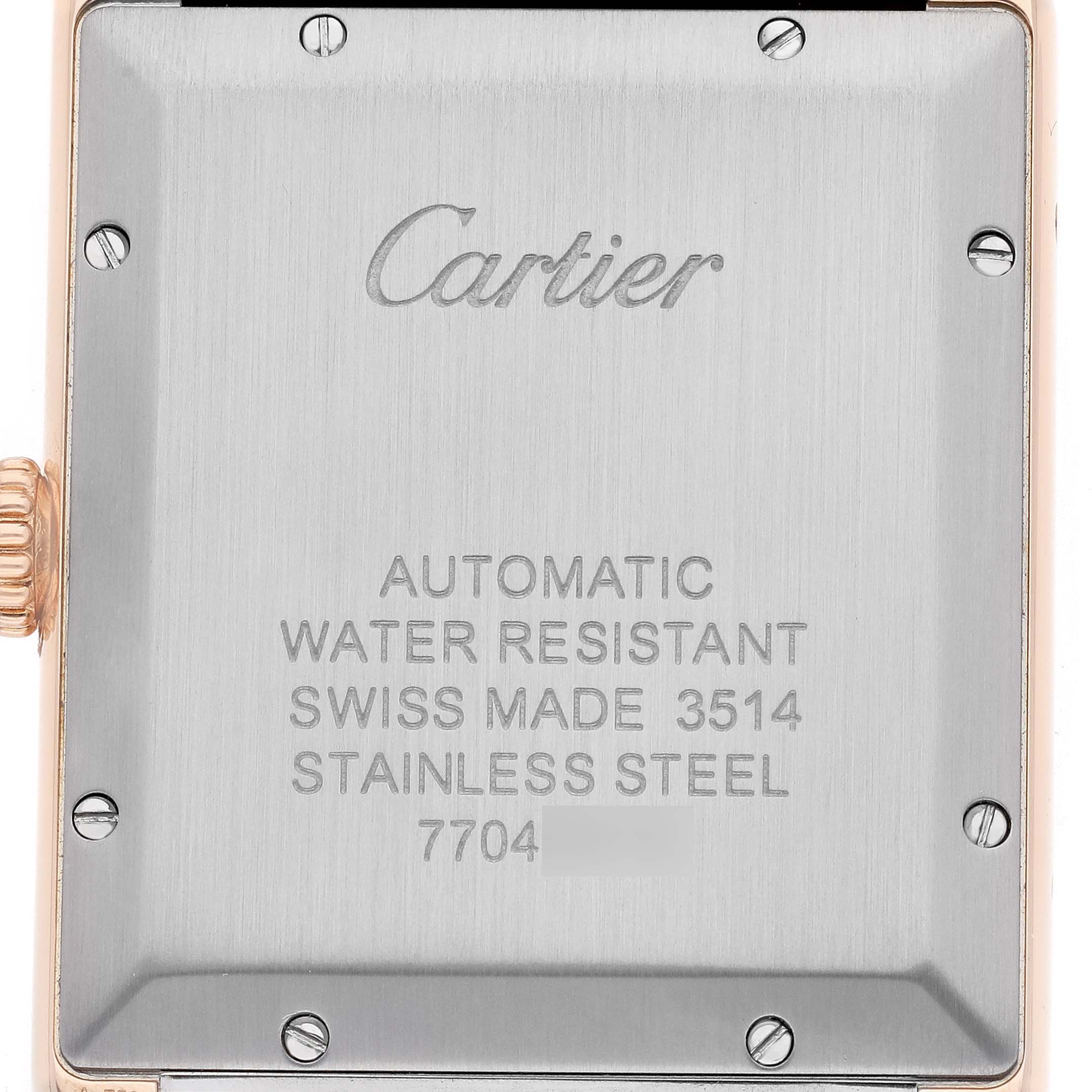 The image shows the stainless steel case back of a Cartier Tank Solo W5200026 Men's Steel and Gold (two tone) Silver Dial watch.