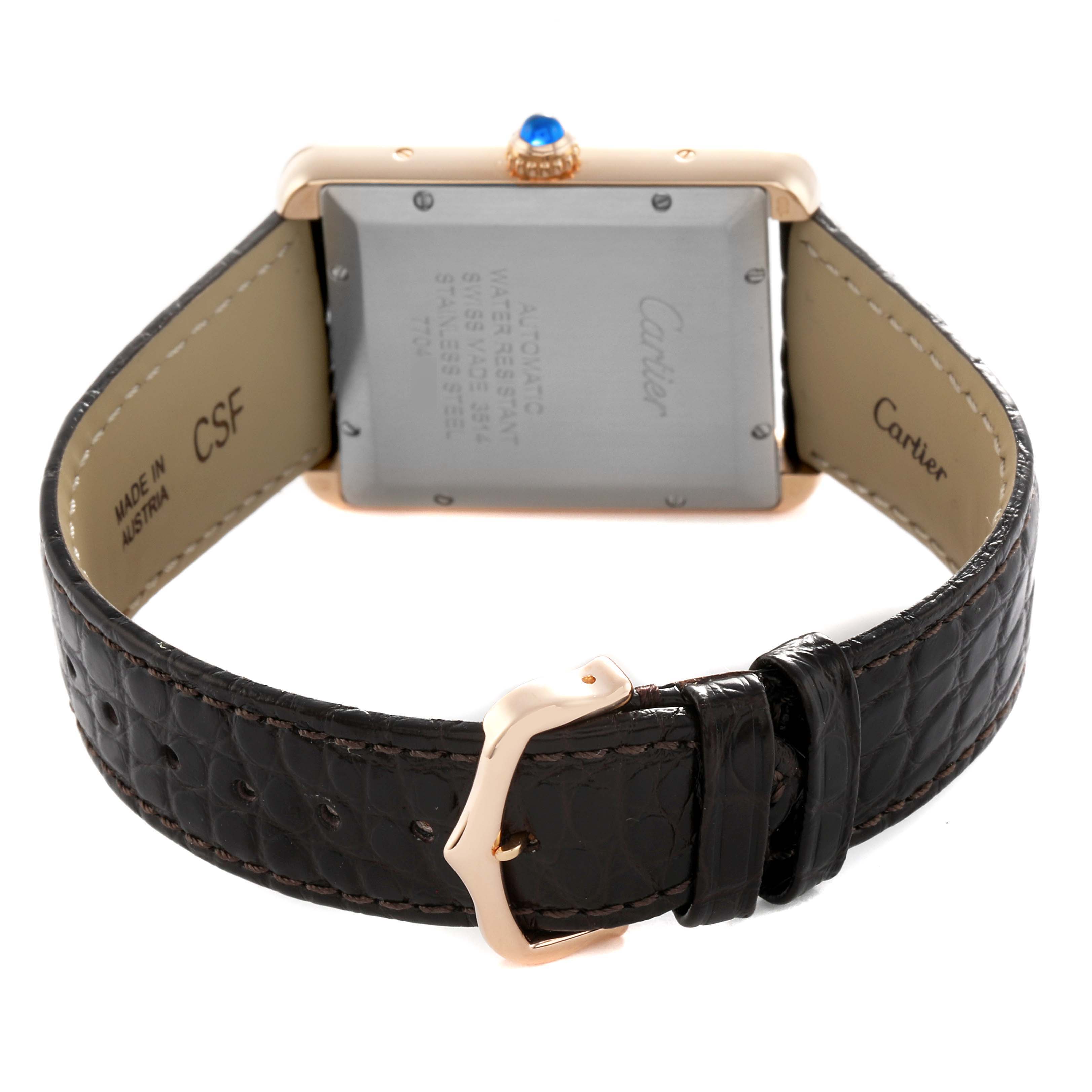 The Cartier Tank Solo W5200026 Men's Steel and Gold (two tone) Silver Dial watch is shown from the back, highlighting its case, buckle, and leather strap.