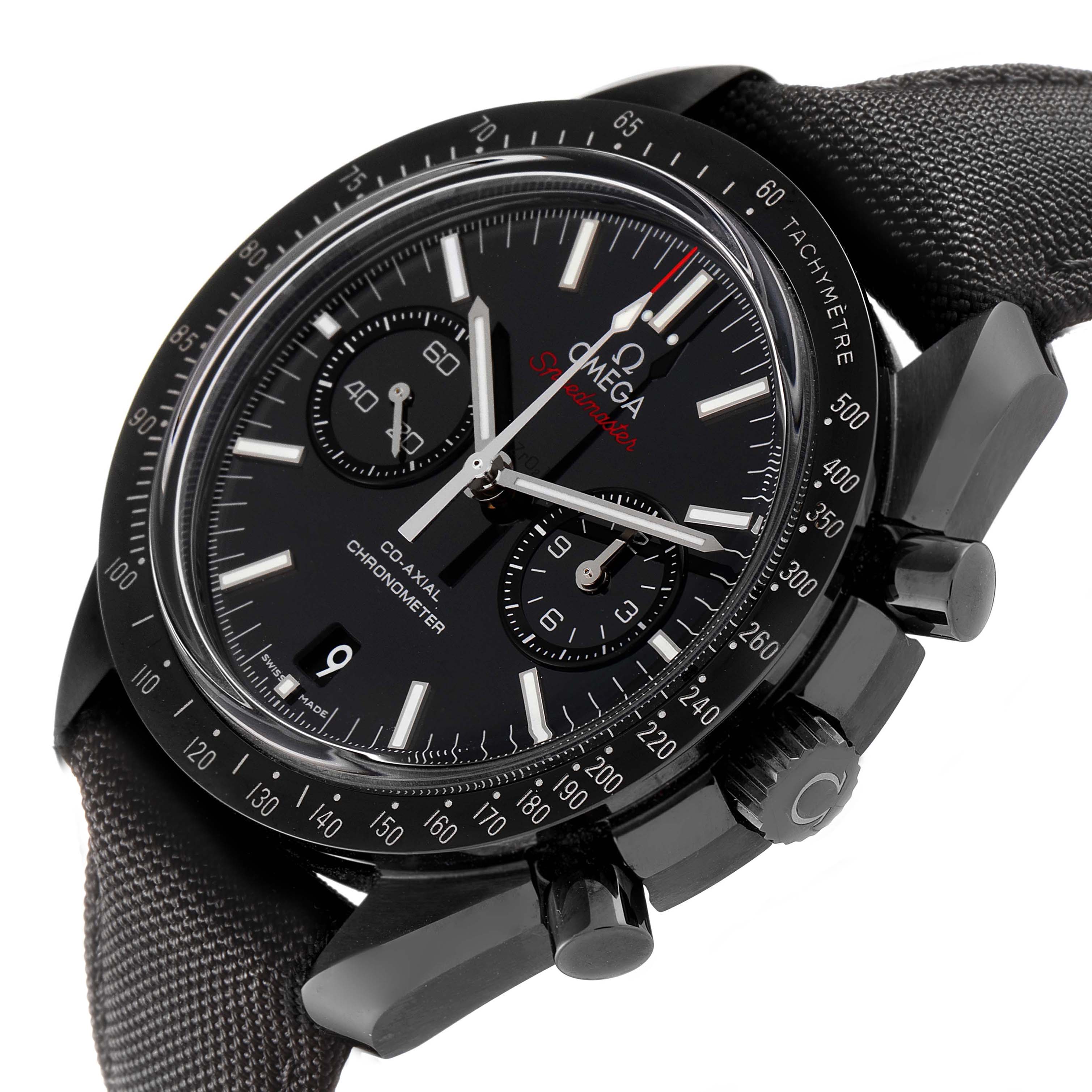 The Omega Speedmaster 311.92.44.51.01.007 Men's Ceramic Black Dial watch is shown at a tilted angle, highlighting the face, bezel, pushers, crown, and textured strap.