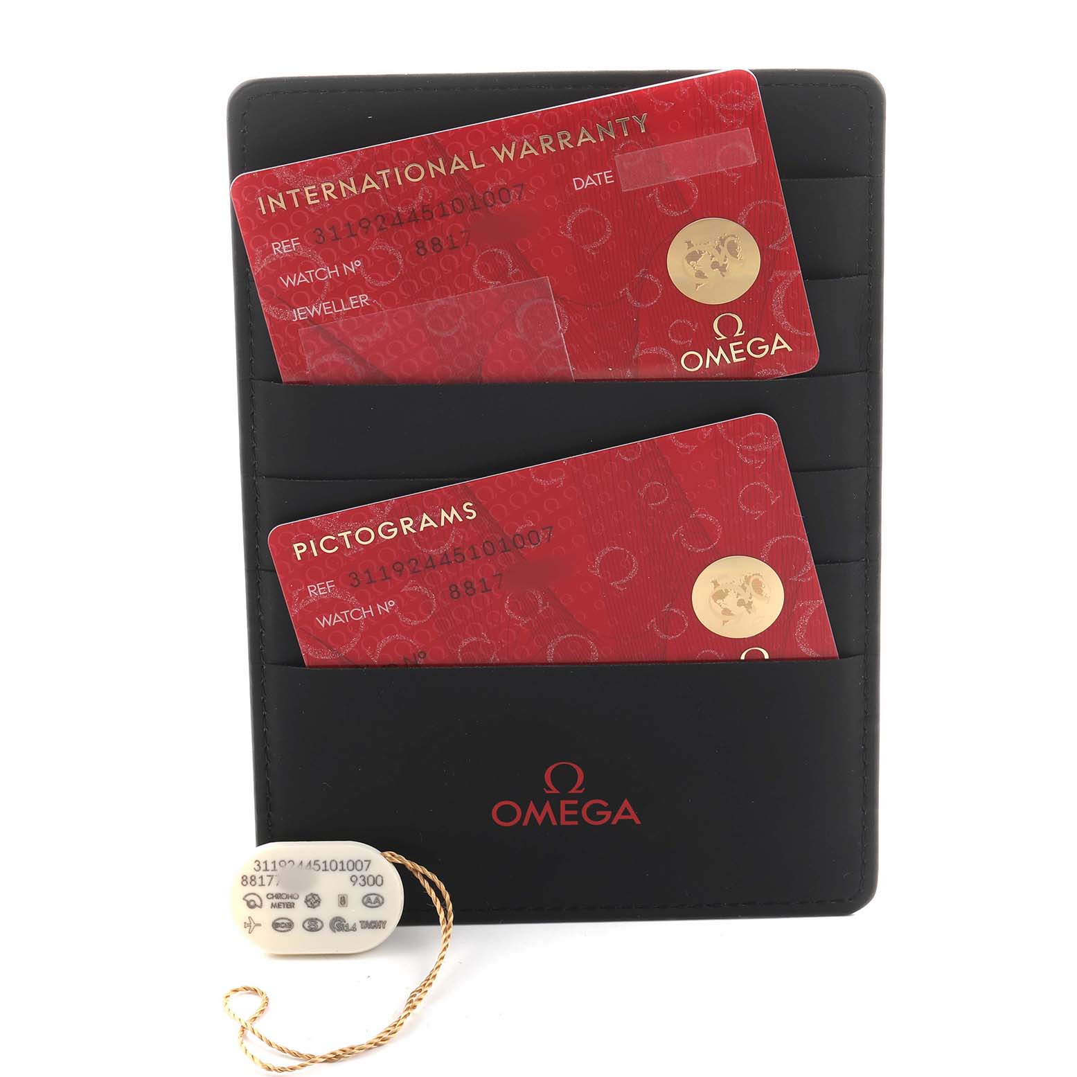 The image shows Omega Speedmaster 311.92.44.51.01.007 Men's Ceramic Black Dial accessories: red warranty and pictogram cards in a black cardholder, along with a small tag.