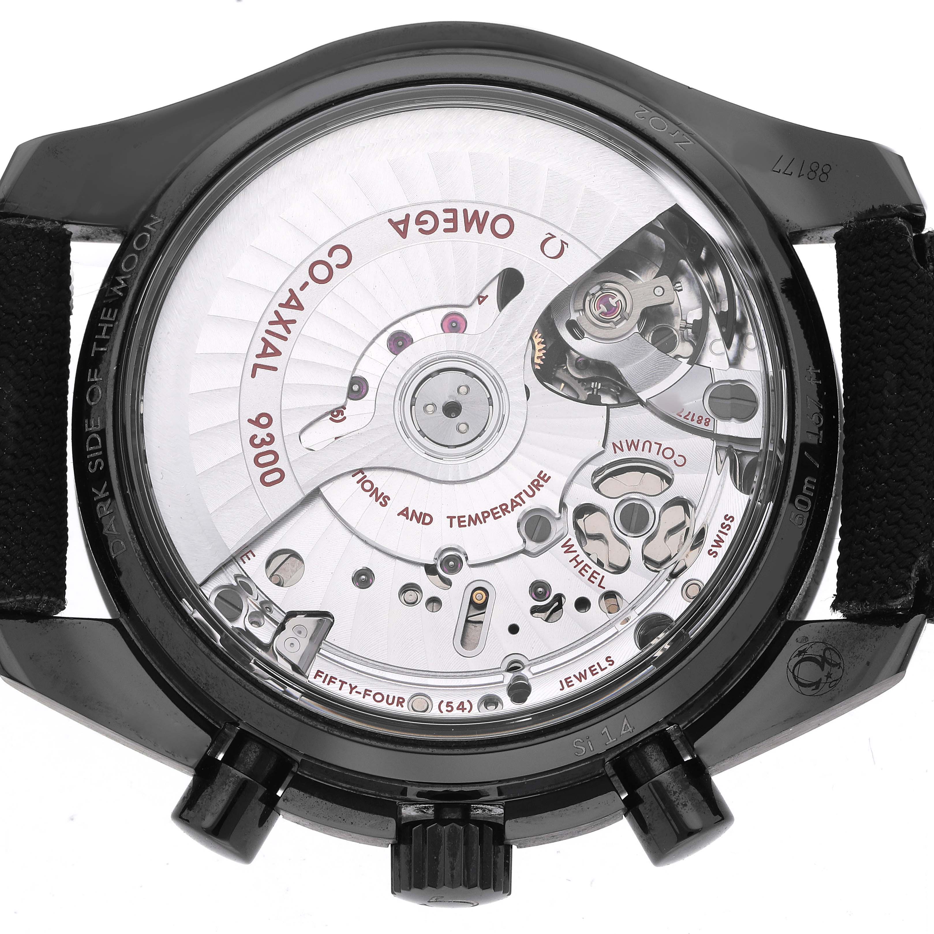 The image shows the back view of an Omega Speedmaster 311.92.44.51.01.007 Men's Ceramic Black Dial, highlighting the inner mechanical workings and co-axial movement.