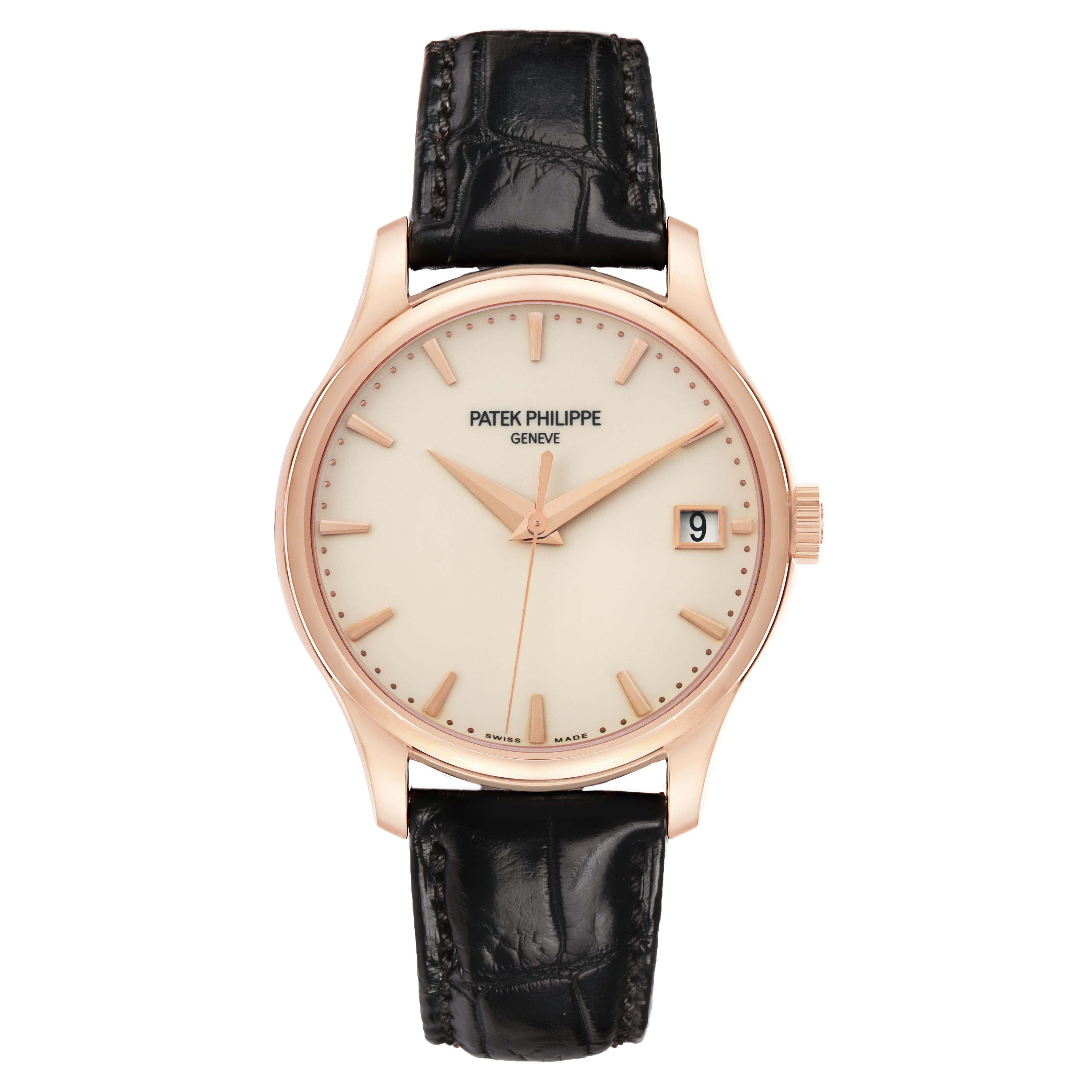 The Patek Philippe Calatrava 5227R Men's Rose Gold Beige Dial watch is shown from a top-down angle, highlighting its dial, hands, and leather strap.