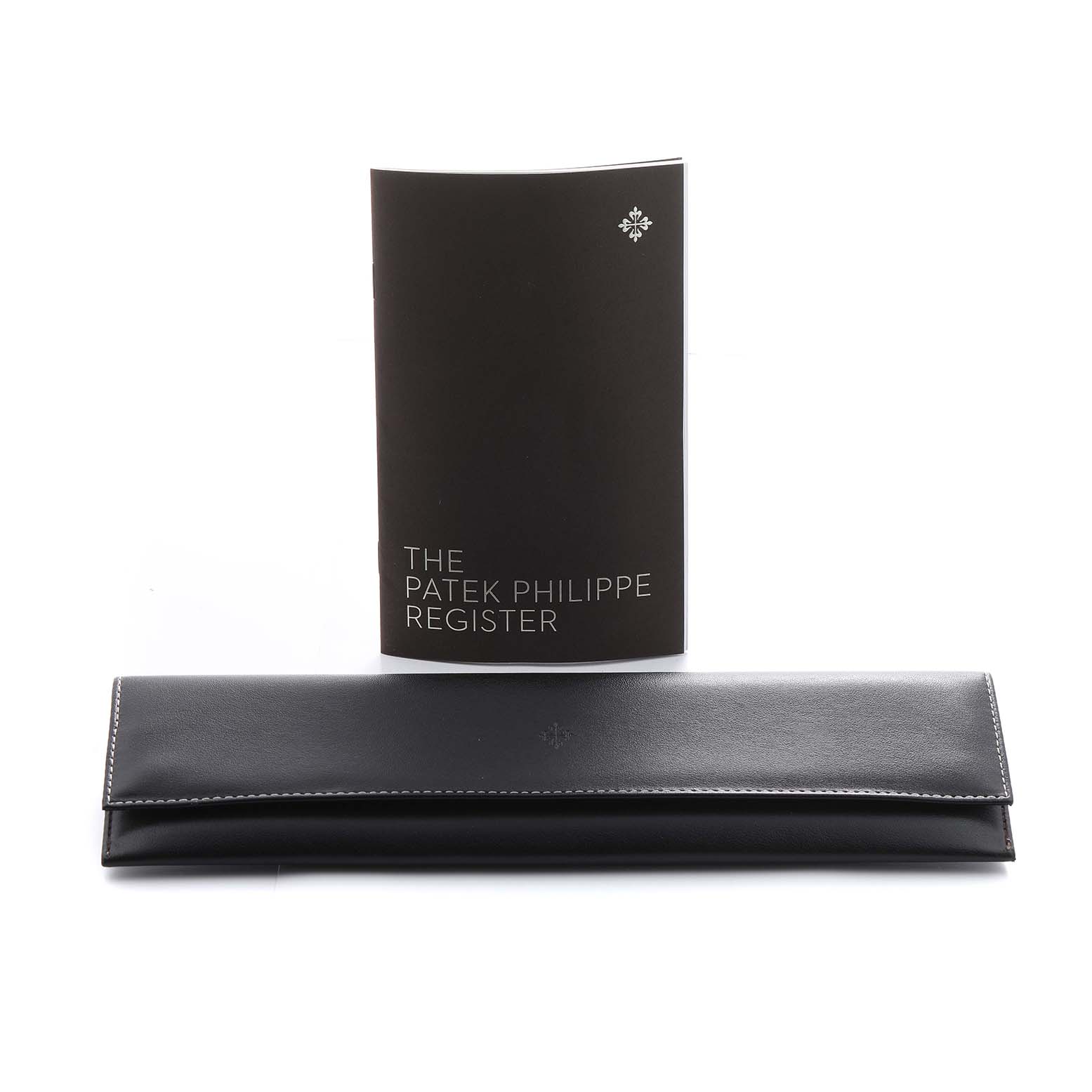 The image shows a Patek Philippe Calatrava 5227R Men's Rose Gold Beige Dial watch pouch and a register booklet from a front angle.