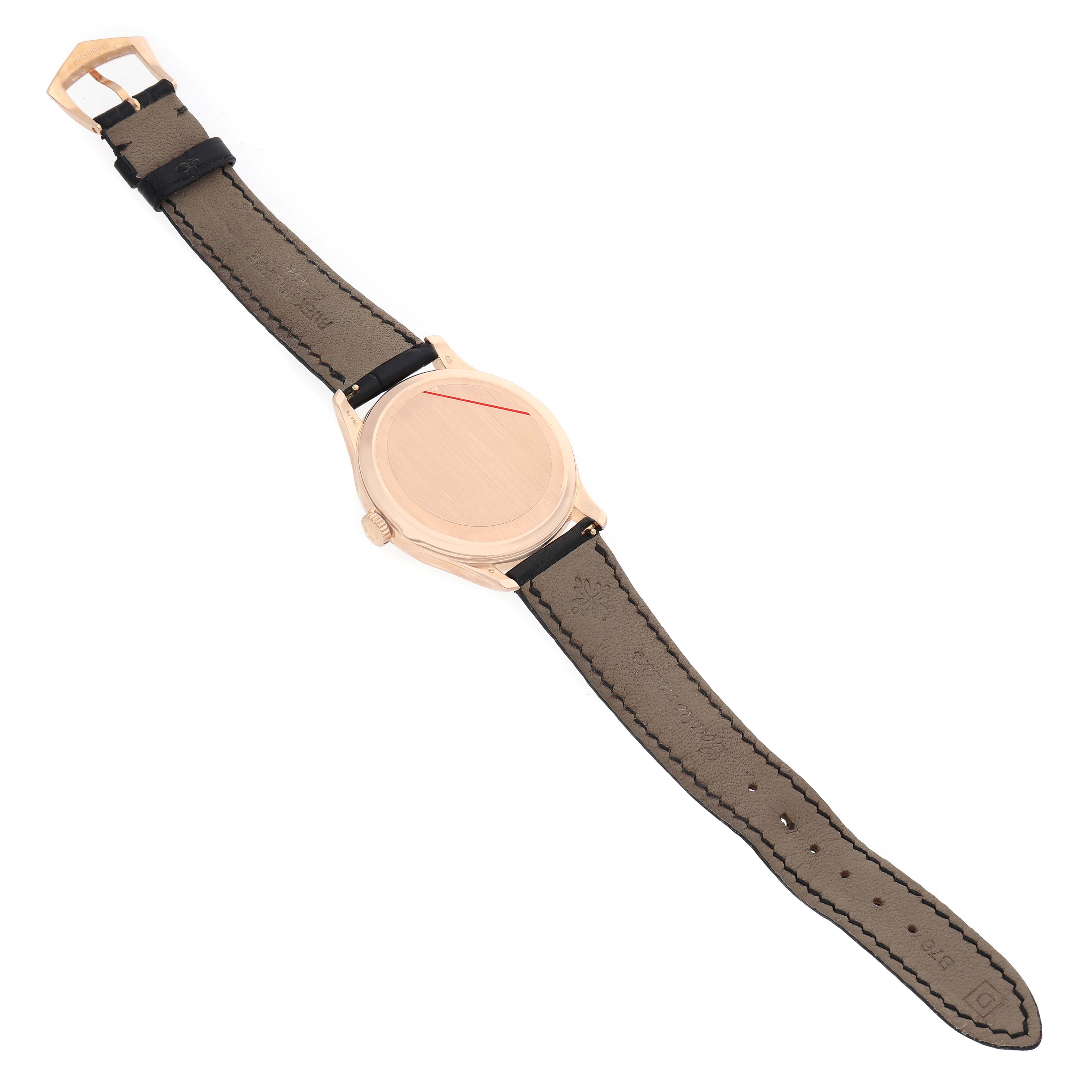 The image shows a Patek Philippe Calatrava 5227R Men's Rose Gold Beige Dial watch from the top, highlighting the strap and case back.