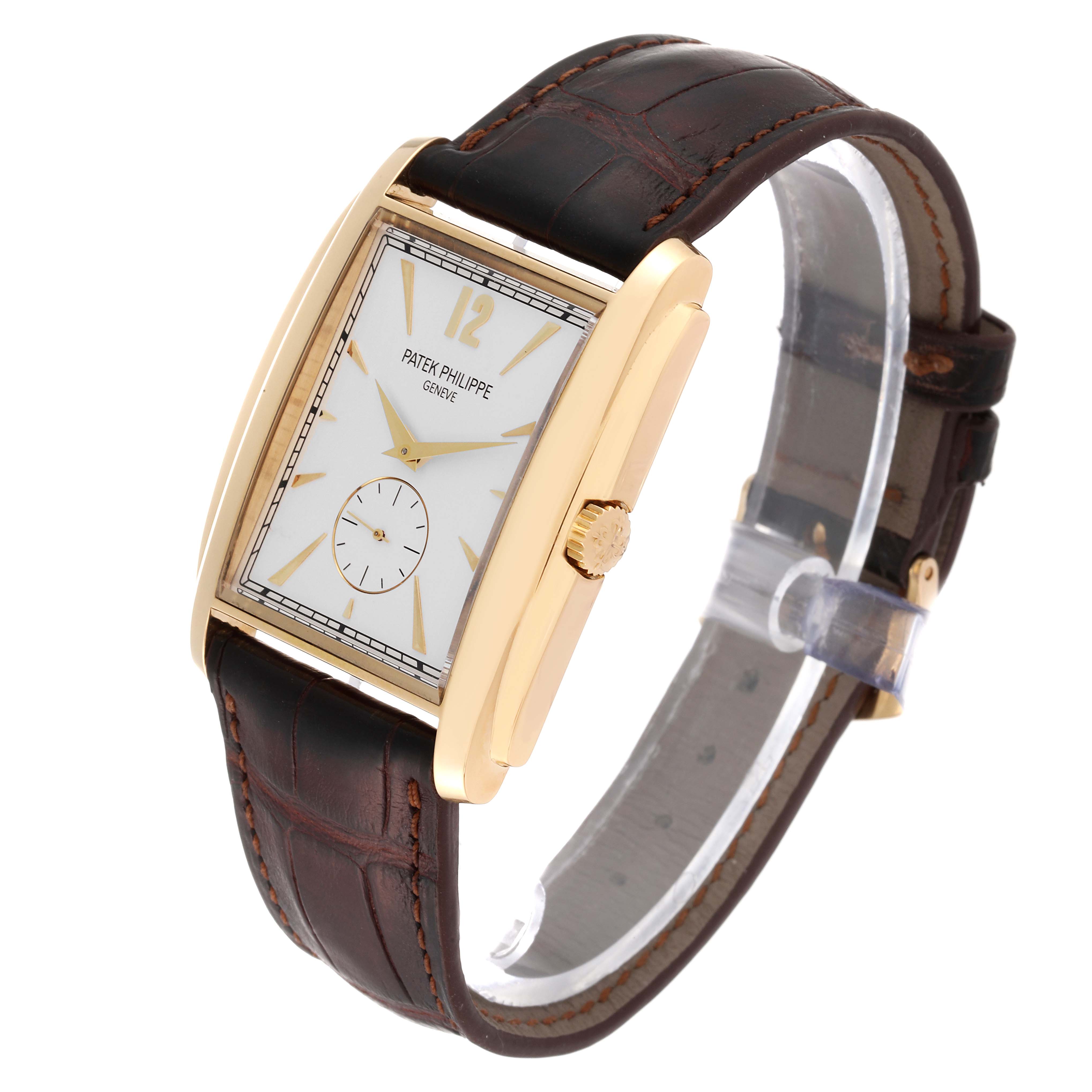 The image shows a Patek Philippe Gondolo 5124J Men's Yellow Gold Silver Dial 5124J Men's Yellow Gold Silver Dial watch from a three-quarter angle, highlighting its rectangular dial, gold case, and leather strap.