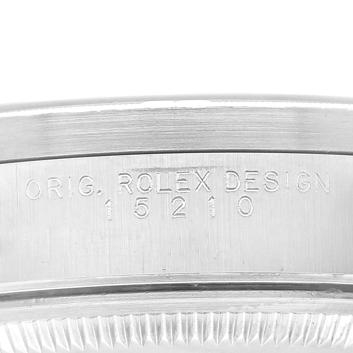 This image shows a close-up of the side of the case of a Rolex Date 15210 Men
s Stainless Steel Black Dial 15210 Men
s Stainless Steel Black Dial watch, featuring its original design number (15210).