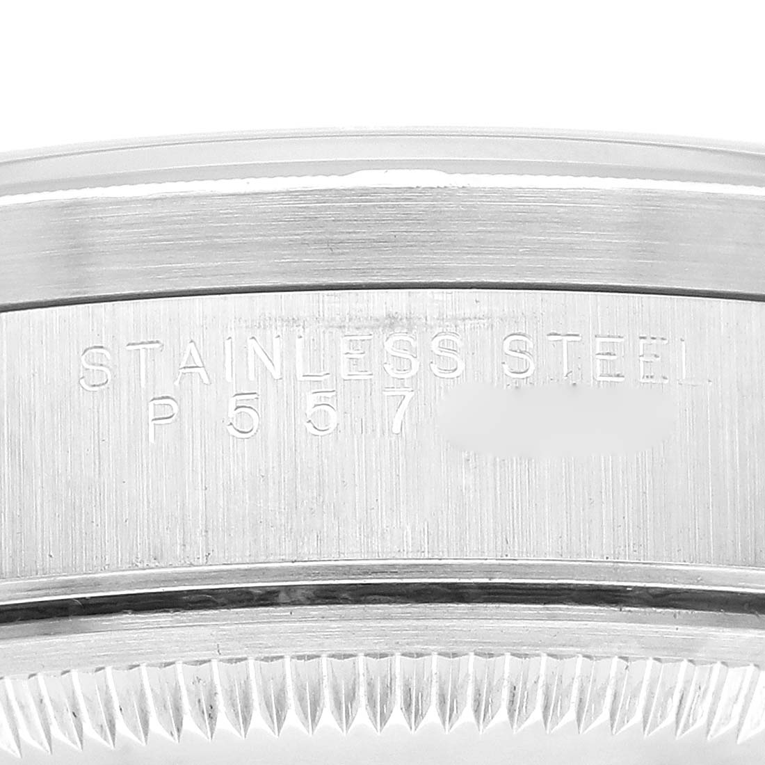 This image shows a close-up of the stainless steel case back of a Rolex Date 15210 Men
s Stainless Steel Black Dial 15210 Men
s Stainless Steel Black Dial model watch.