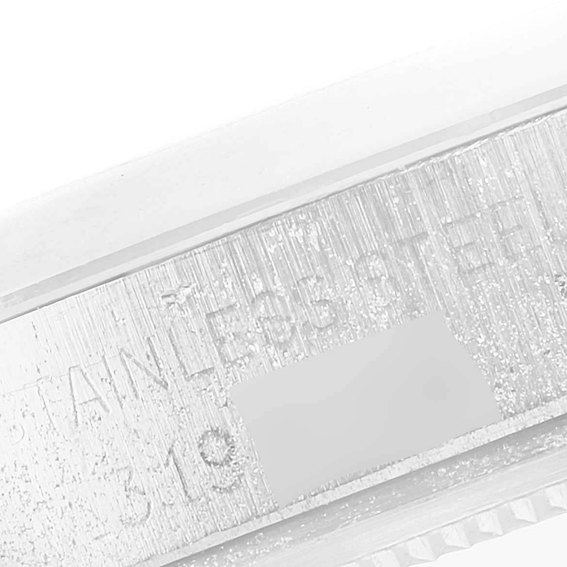 This image shows a close-up view of the side of the Rolex Vintage Collection 1500 Men
s Stainless Steel Silver Dial 1500 Men
s Stainless Steel Silver Dial watch, highlighting its stainless steel serial engraving.