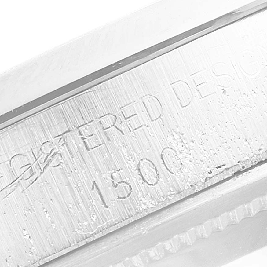 The image shows a close-up of the side engraving on the case of a Vintage Collection Rolex model.