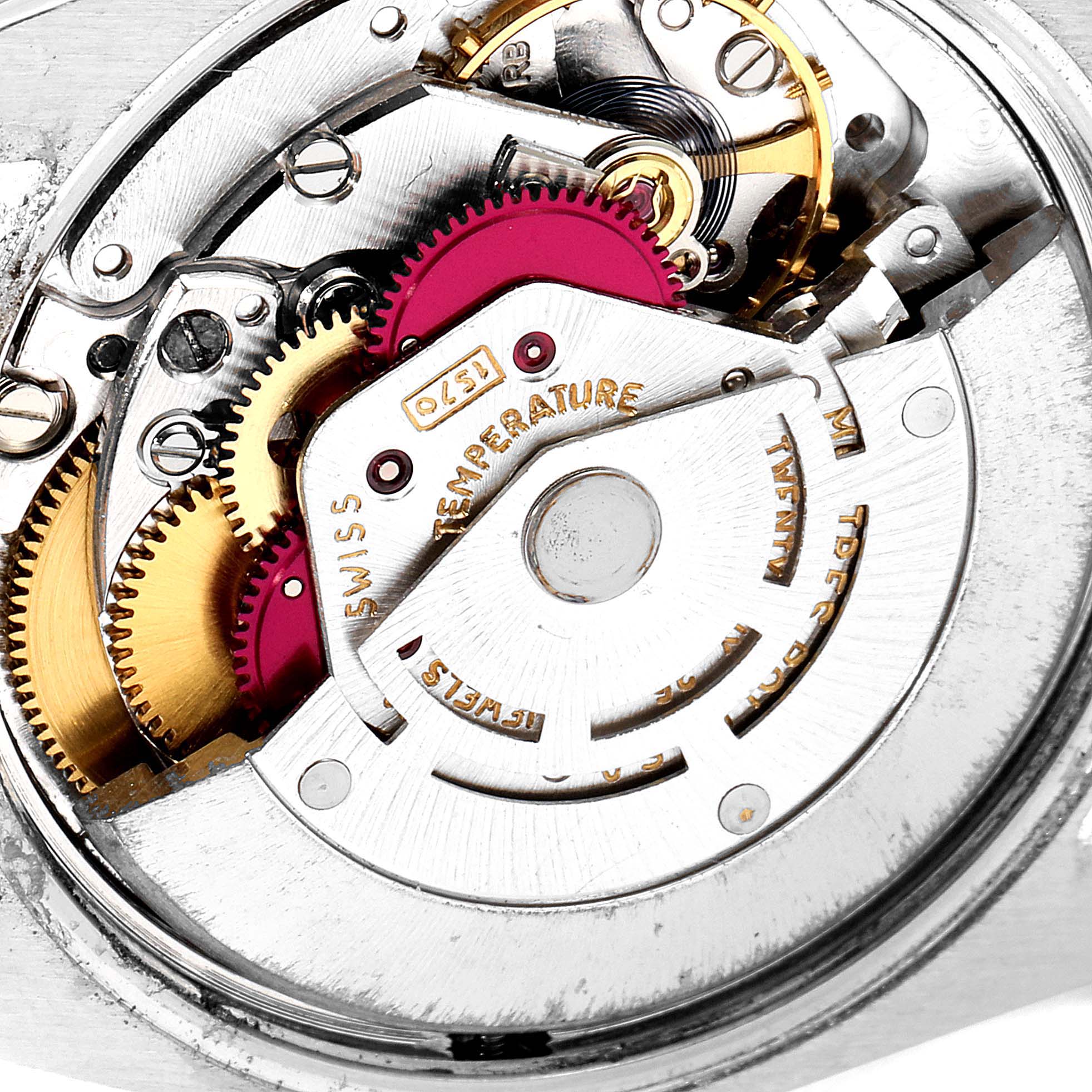 The image shows a close-up of the internal mechanical movement of a Rolex Vintage Collection 1500 Men
s Stainless Steel Silver Dial 1500 Men
s Stainless Steel Silver Dial watch.