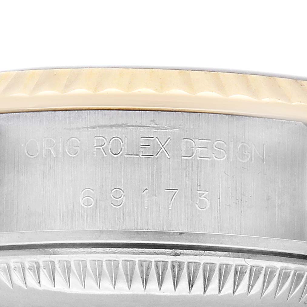 The image displays the side of a Rolex Datejust 69173 Women's Steel and Gold (two tone) Champagne Dial, showing the case with "Orig Rolex Design" engravings and model number.