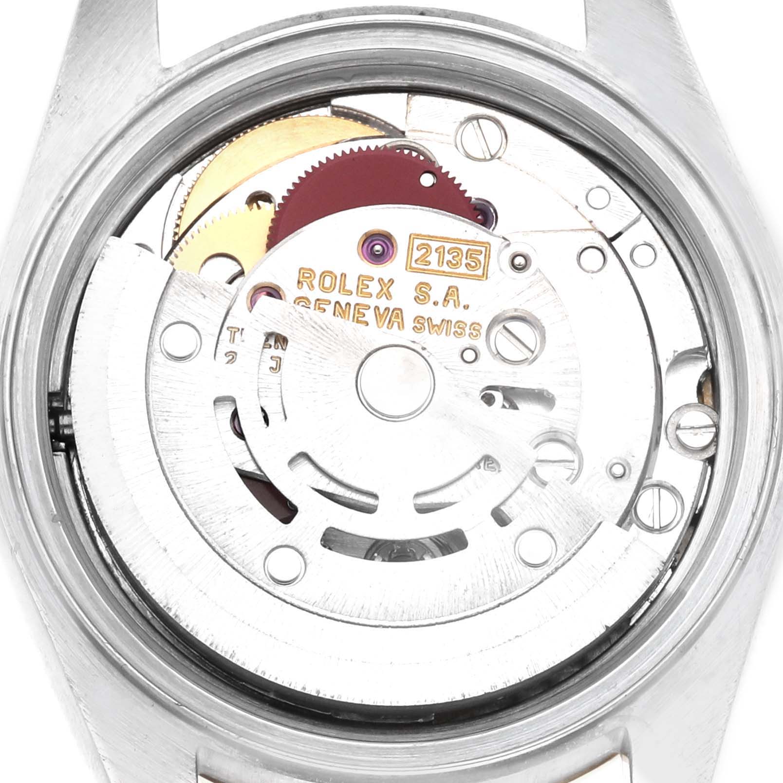 The image shows the movement mechanism of a Rolex Datejust 69173 Women's Steel and Gold (two tone) Champagne Dial from the back, highlighting gears and the rotor.