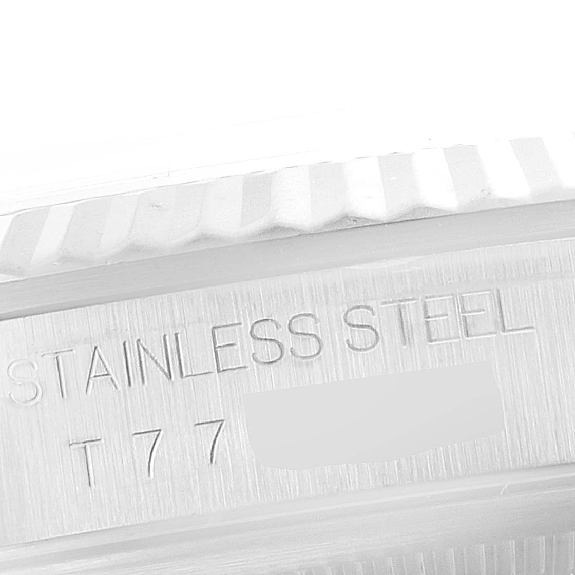 The image shows a close-up angle of the stainless steel part of a Rolex Datejust 16234 Men's Stainless Steel Blue Dial 16234 Men's Stainless Steel Blue Dial model, highlighting the engraved text.