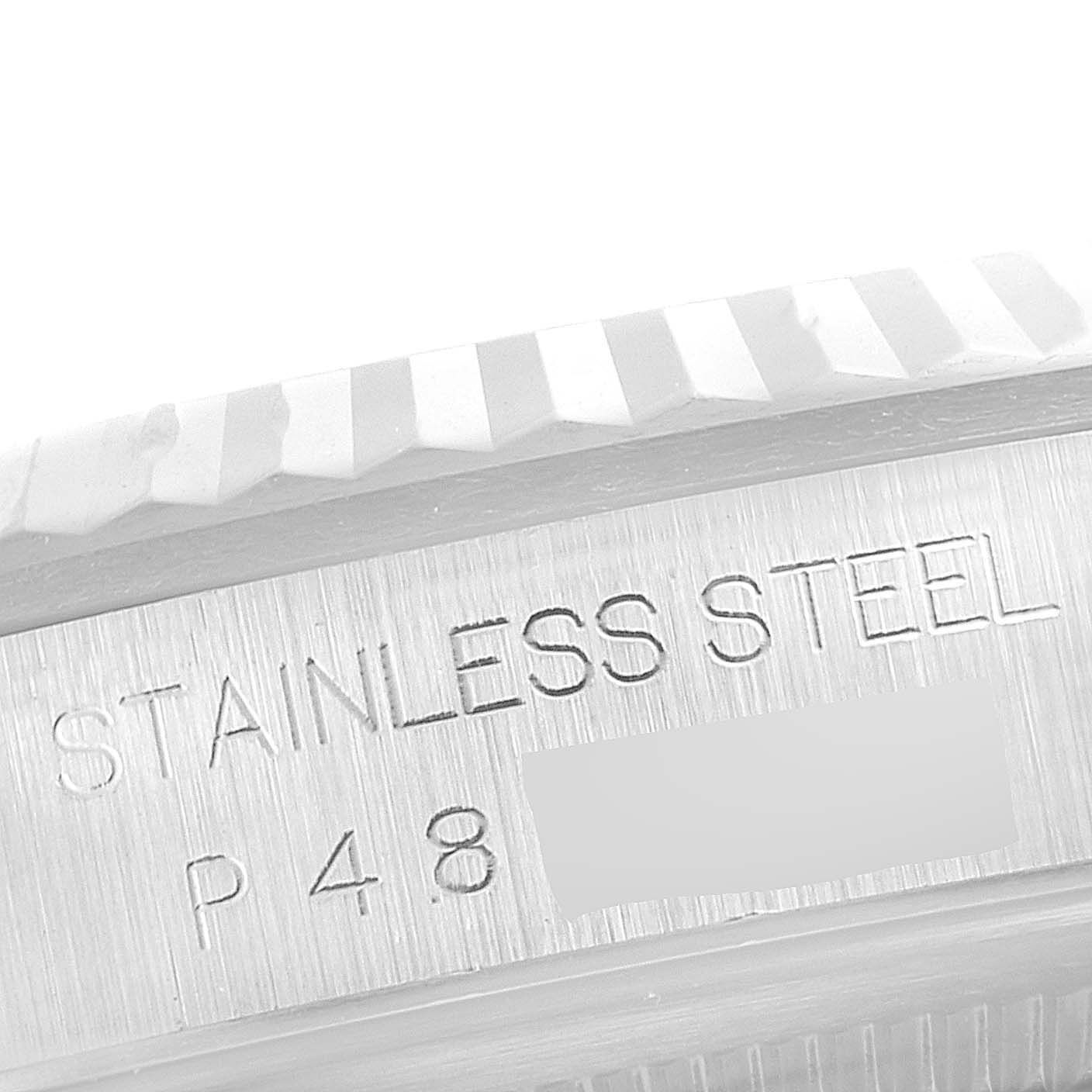 The image shows an angled close-up of the stainless steel bezel and etching on the case of a Rolex Datejust 16234 Men's Stainless Steel White Dial 16234 Men's Stainless Steel White Dial watch.