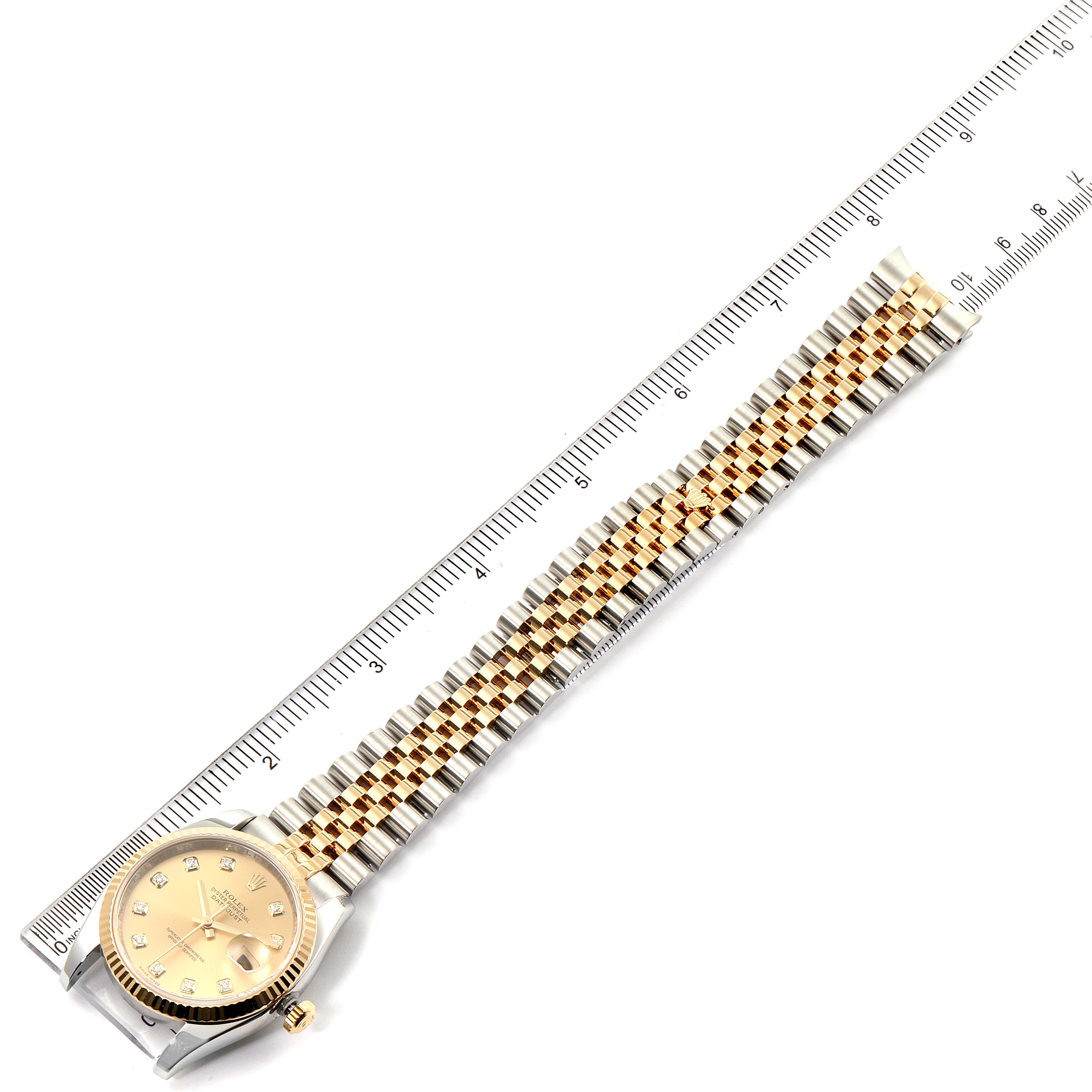 The image displays a Rolex Datejust 116233 Men's Steel and Gold (two tone) Champagne Dial 116233 Men's Steel and Gold (two tone) Champagne Dial watch laid flat with the watch face and the full length of the bracelet visible next to a ruler.
