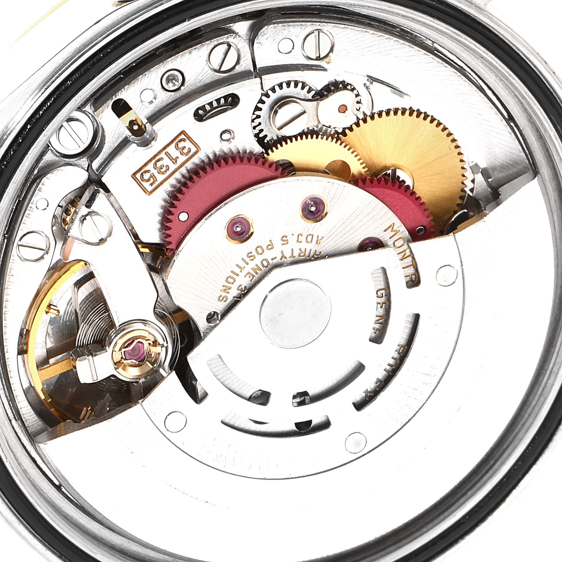 The image shows the internal mechanical movement of a Rolex Datejust 16233 Men's Steel and Gold (two tone) Champagne Dial 16233 Men's Steel and Gold (two tone) Champagne Dial watch, including gears and the rotor.