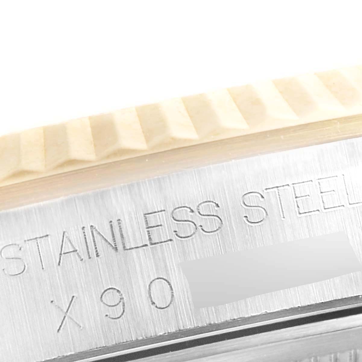 This image shows a close-up view of the stainless steel case and part of the fluted bezel of a Rolex Datejust 16233 Men's Steel and Gold (two tone) Champagne Dial 16233 Men's Steel and Gold (two tone) Champagne Dial watch.