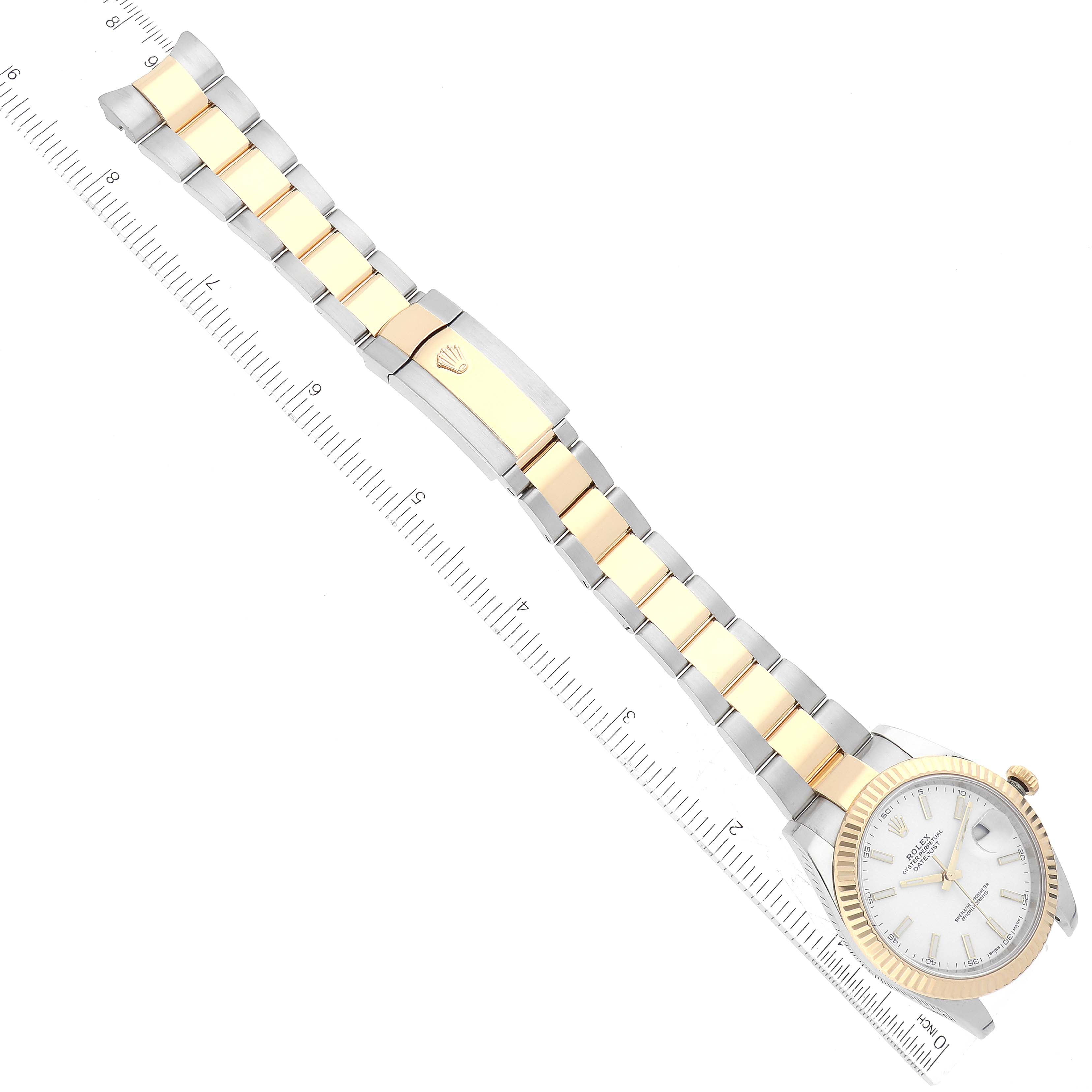 The image shows the Rolex Datejust 41 126333 Men's Steel and Gold (two tone) White Dial 126333 Men's Steel and Gold (two tone) White Dial model from a top-down view, highlighting the dial, bezel, and bracelet alongside a ruler.