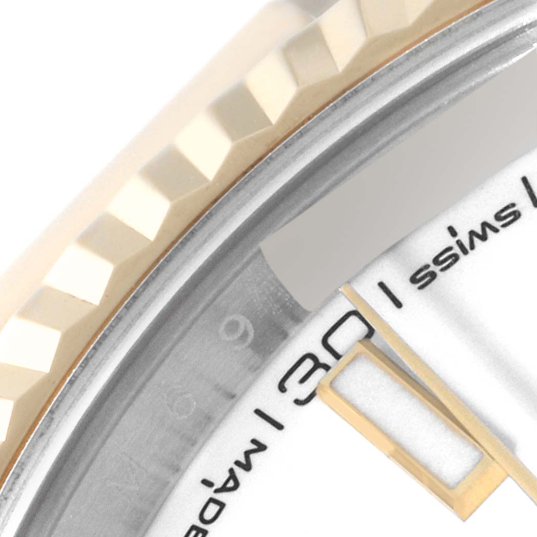 This close-up image of the Rolex Datejust 41 126333 Men's Steel and Gold (two tone) White Dial 126333 Men's Steel and Gold (two tone) White Dial shows the fluted bezel, part of the dial, and the date window at 30.
