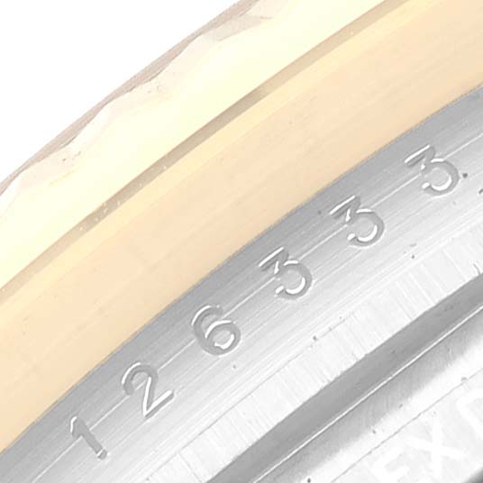 This image shows a close-up of the bezel and rehaut of a Rolex Datejust 41 126333 Men's Steel and Gold (two tone) White Dial 126333 Men's Steel and Gold (two tone) White Dial watch.